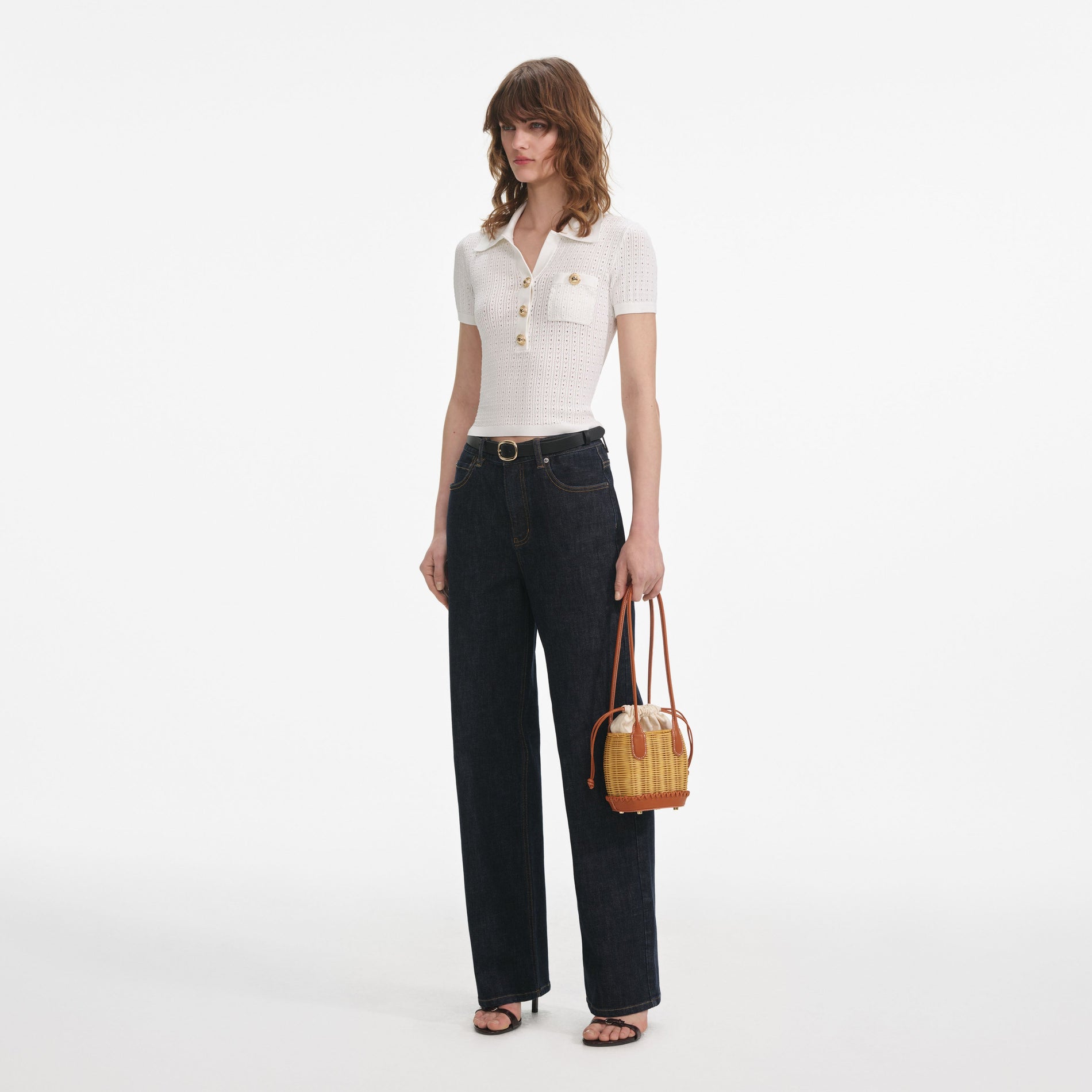 Side view of a woman wearing the White Pointelle Knit Top