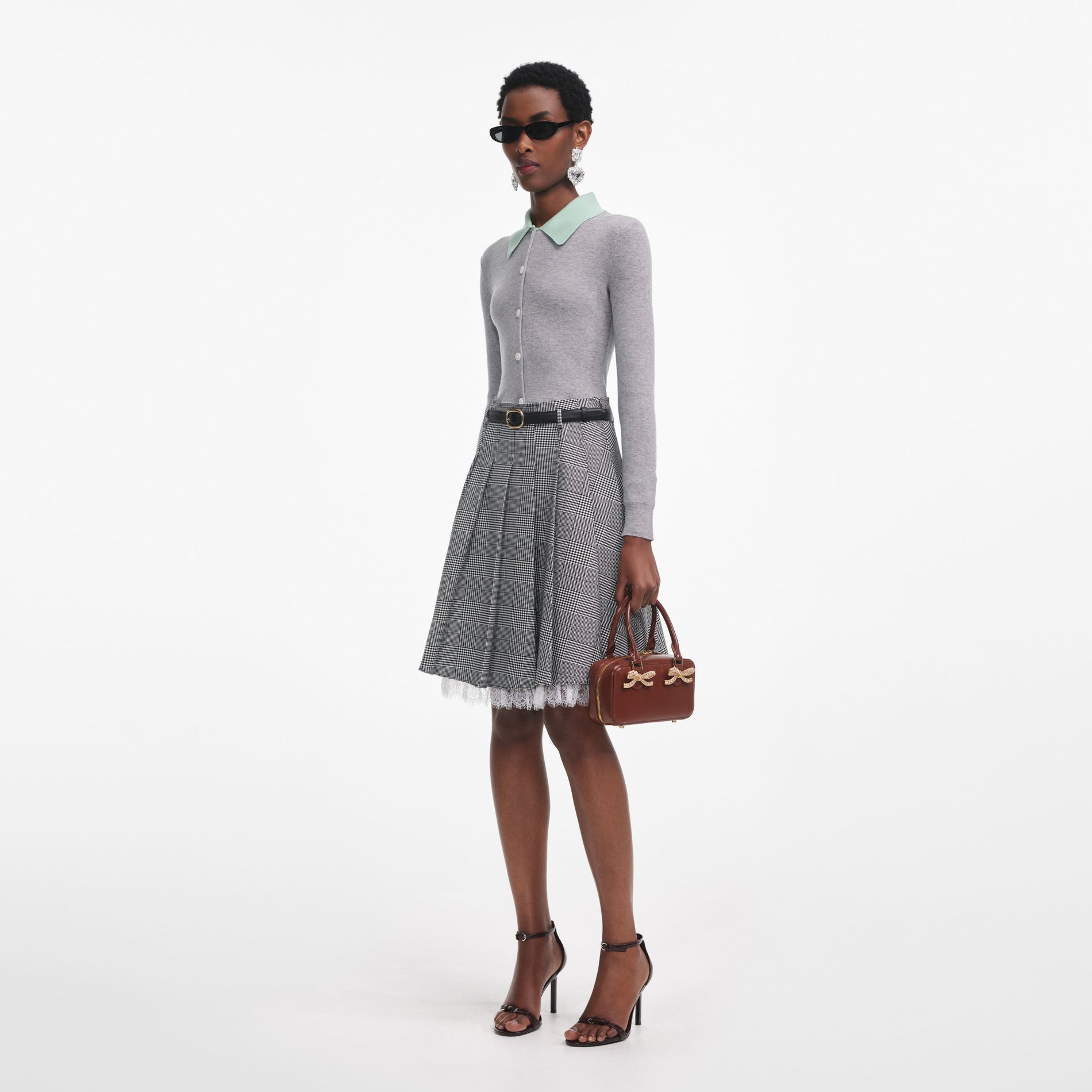 Side view of a woman wearing the Grey Merino Wool Cardigan