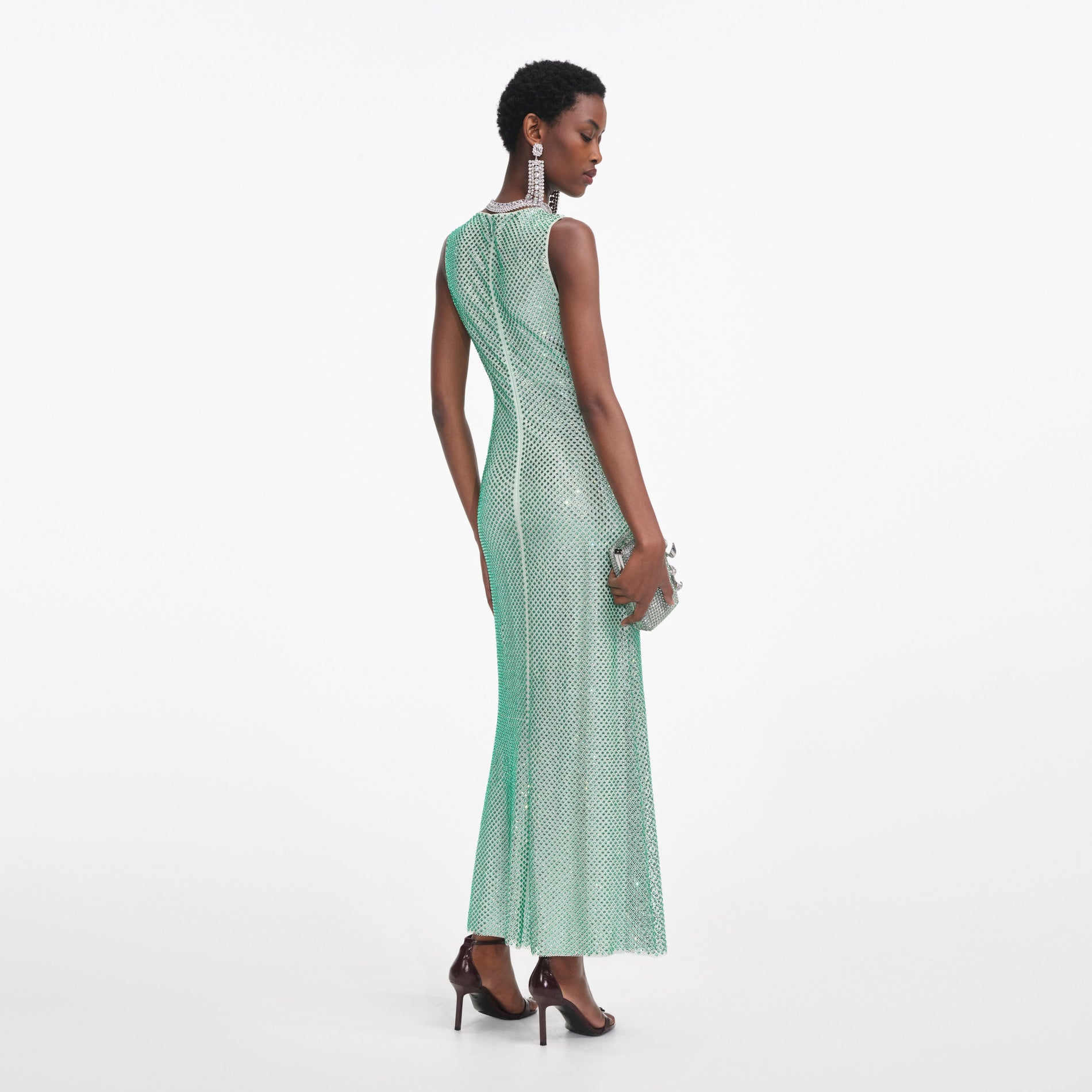 Back view of a woman wearing the Mint Rhinestone Mesh Midi Dress