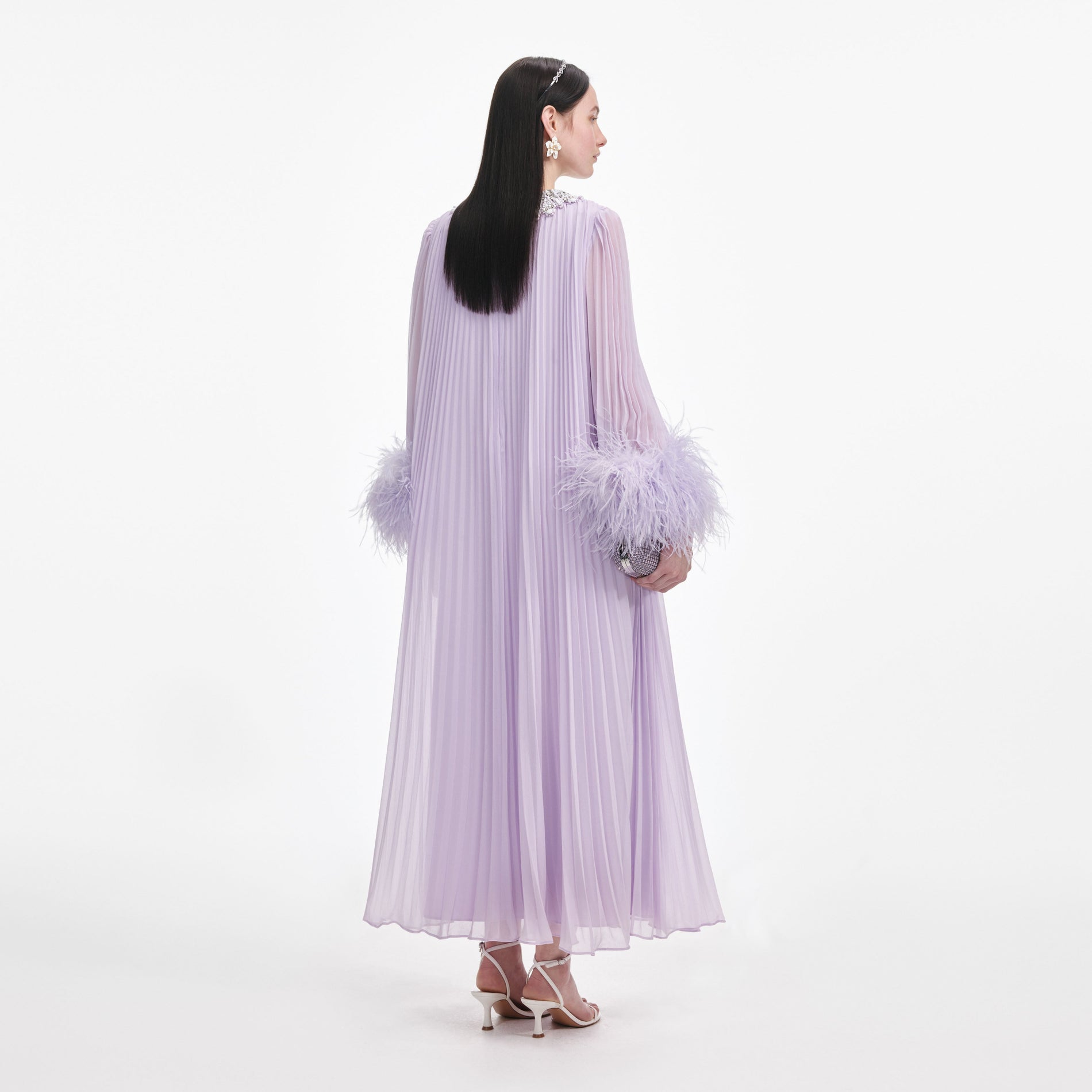 Back view of a woman wearing the Lilac Chiffon Feather Midi Dress