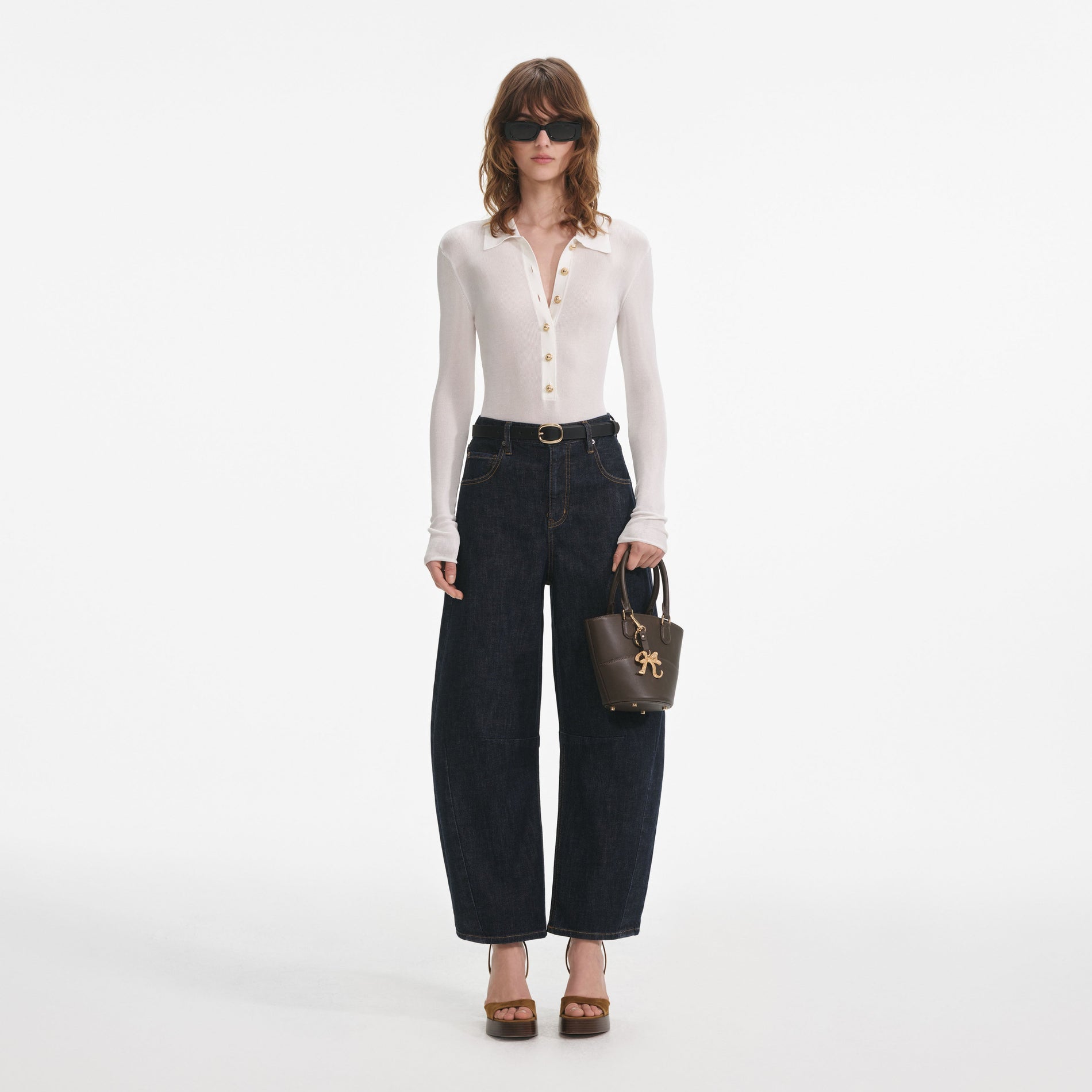 Front view of a woman wearing the White Viscose Knit Bodysuit