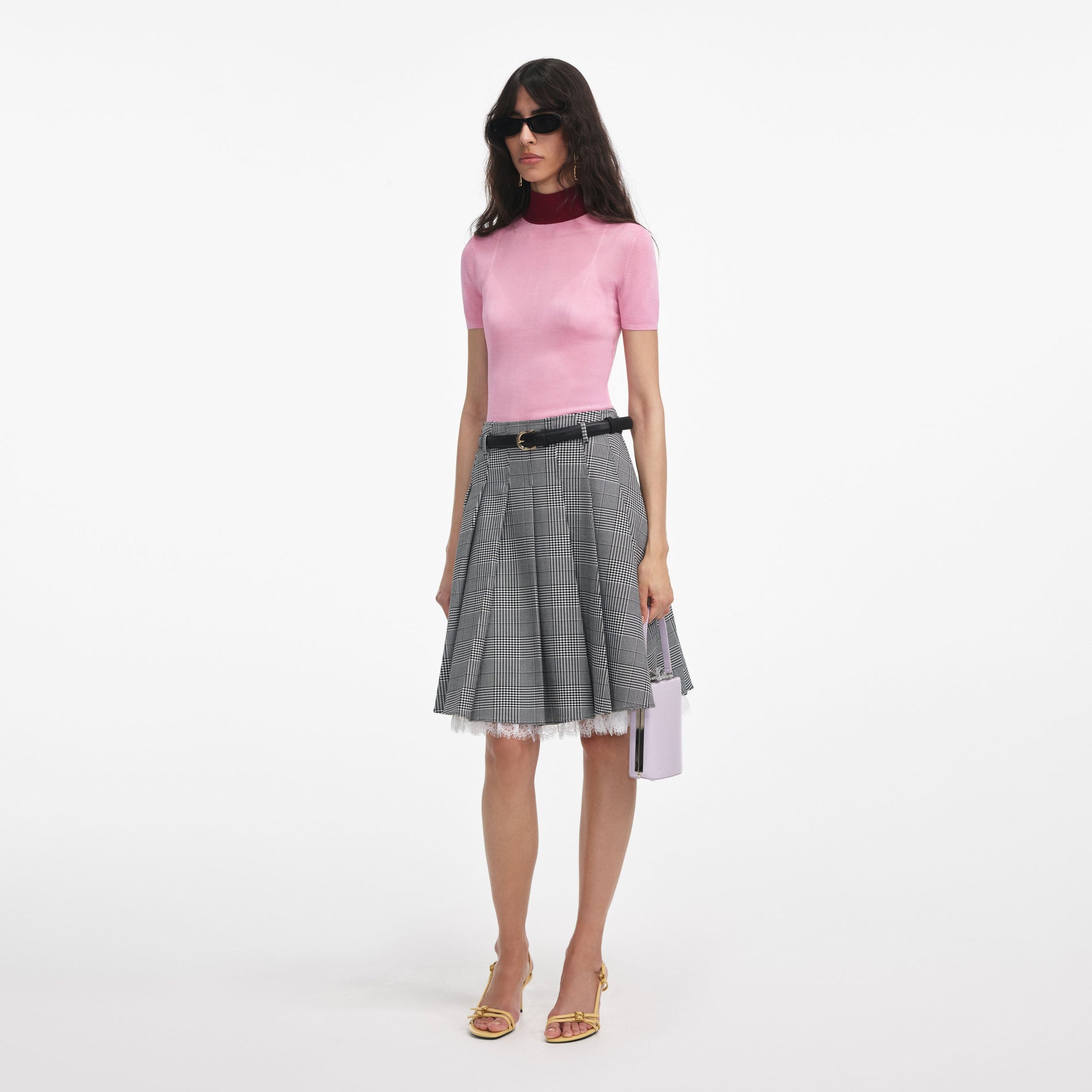 Side view of a woman wearing the Pink Viscose Knit Short Sleeve Top