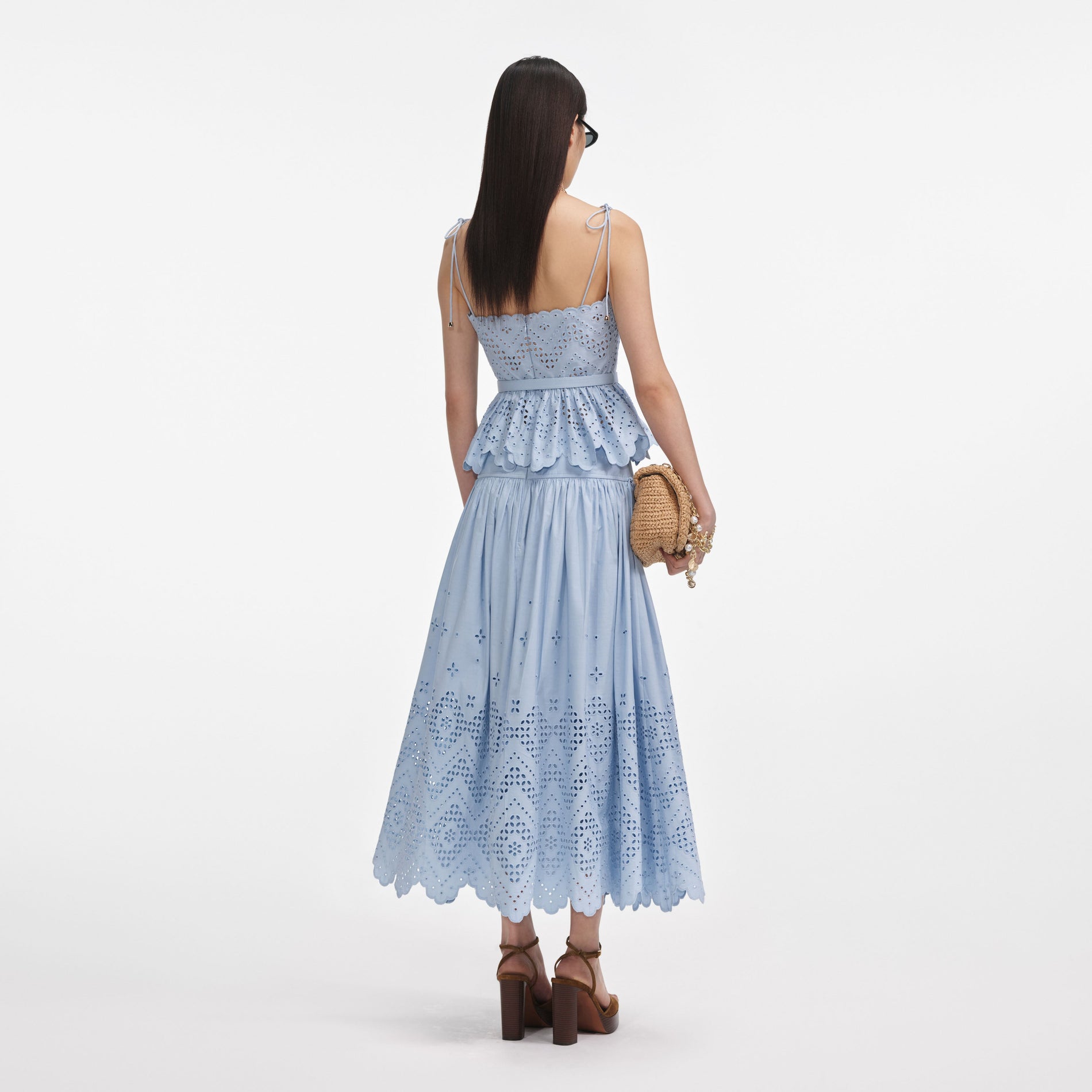Back view of a woman wearing the Blue Cotton Broderie Top