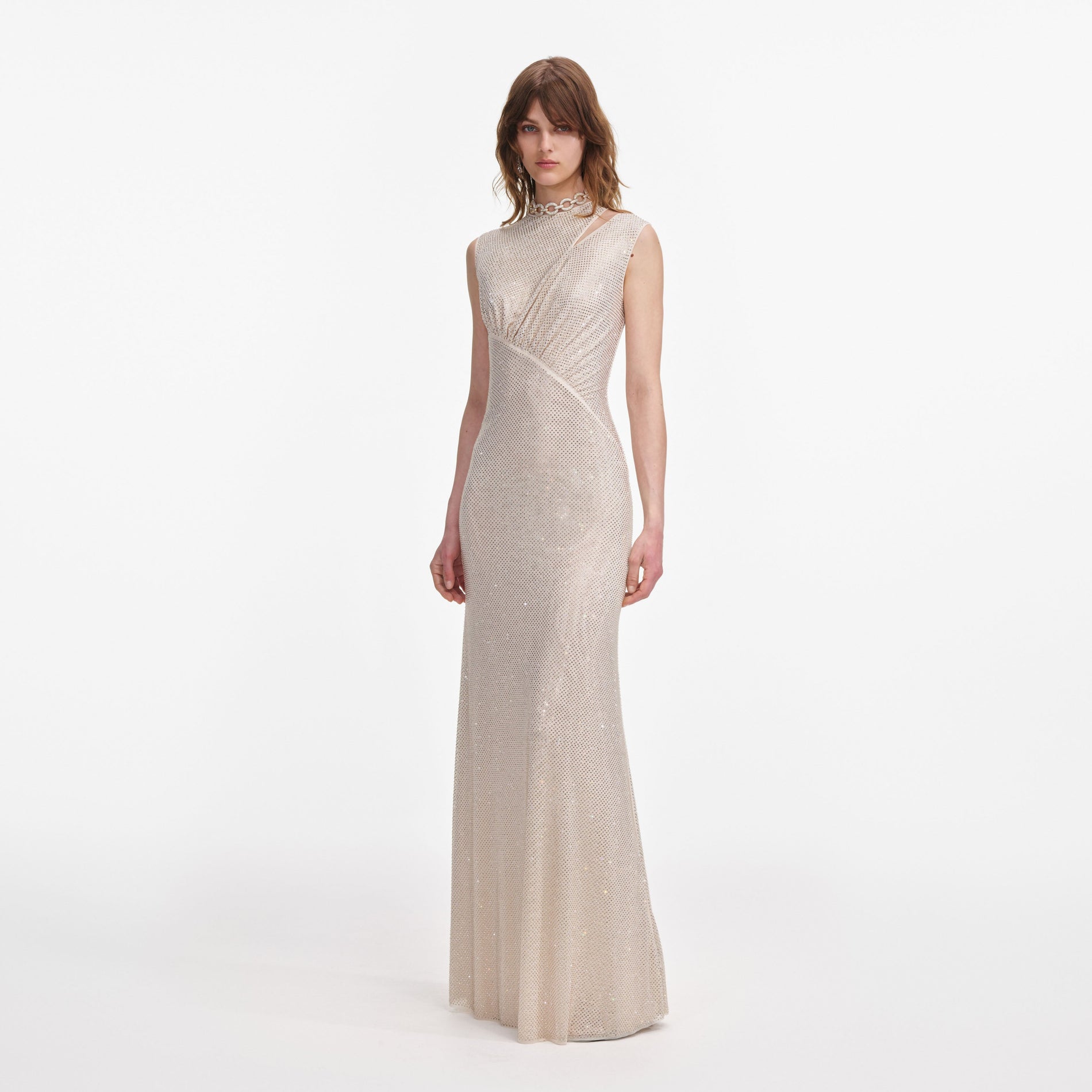 Side view of a woman wearing the Champagne Rhinestone Cut Out Maxi Dress