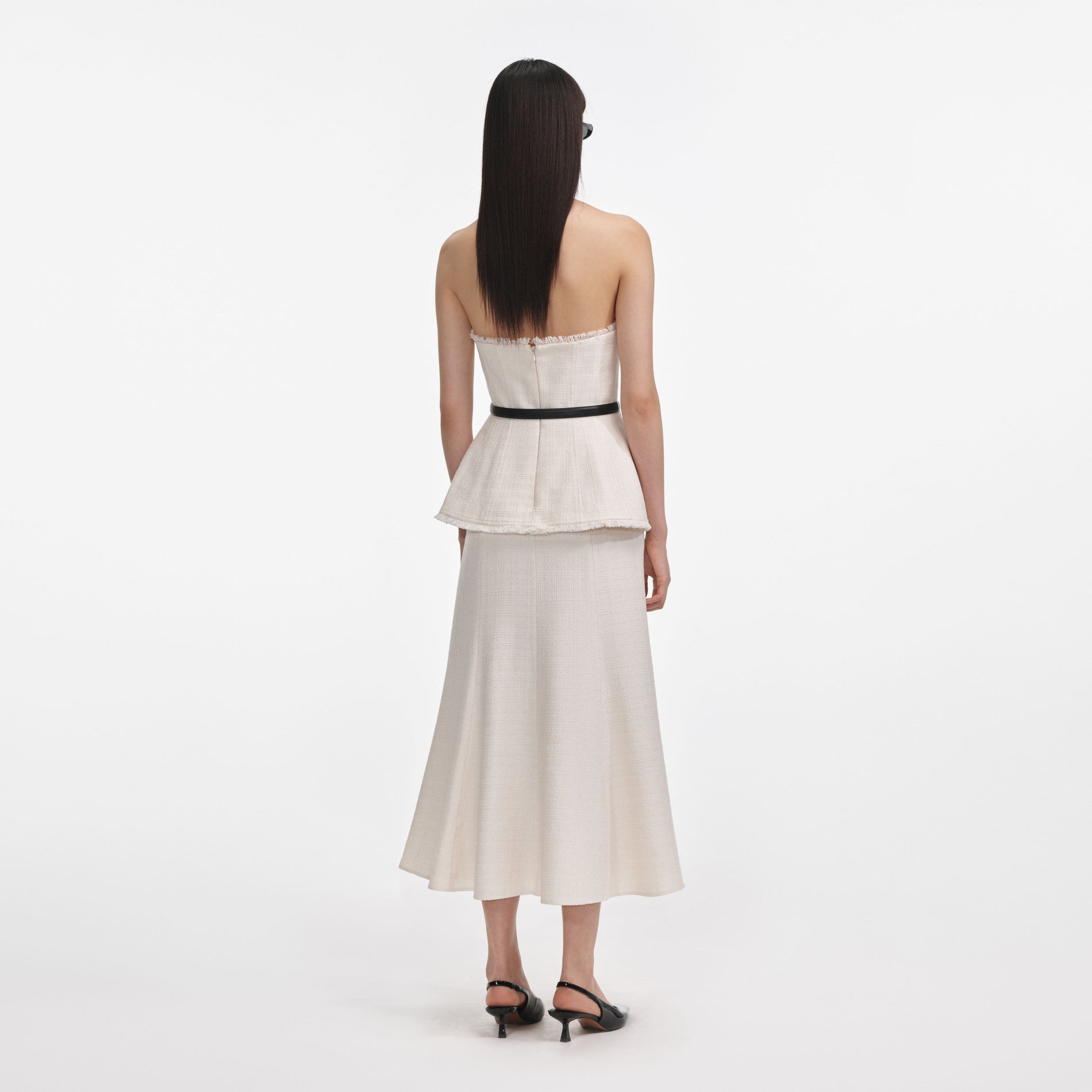 Back view of a woman wearing the Cream Boucle Bandeau Midi Dress