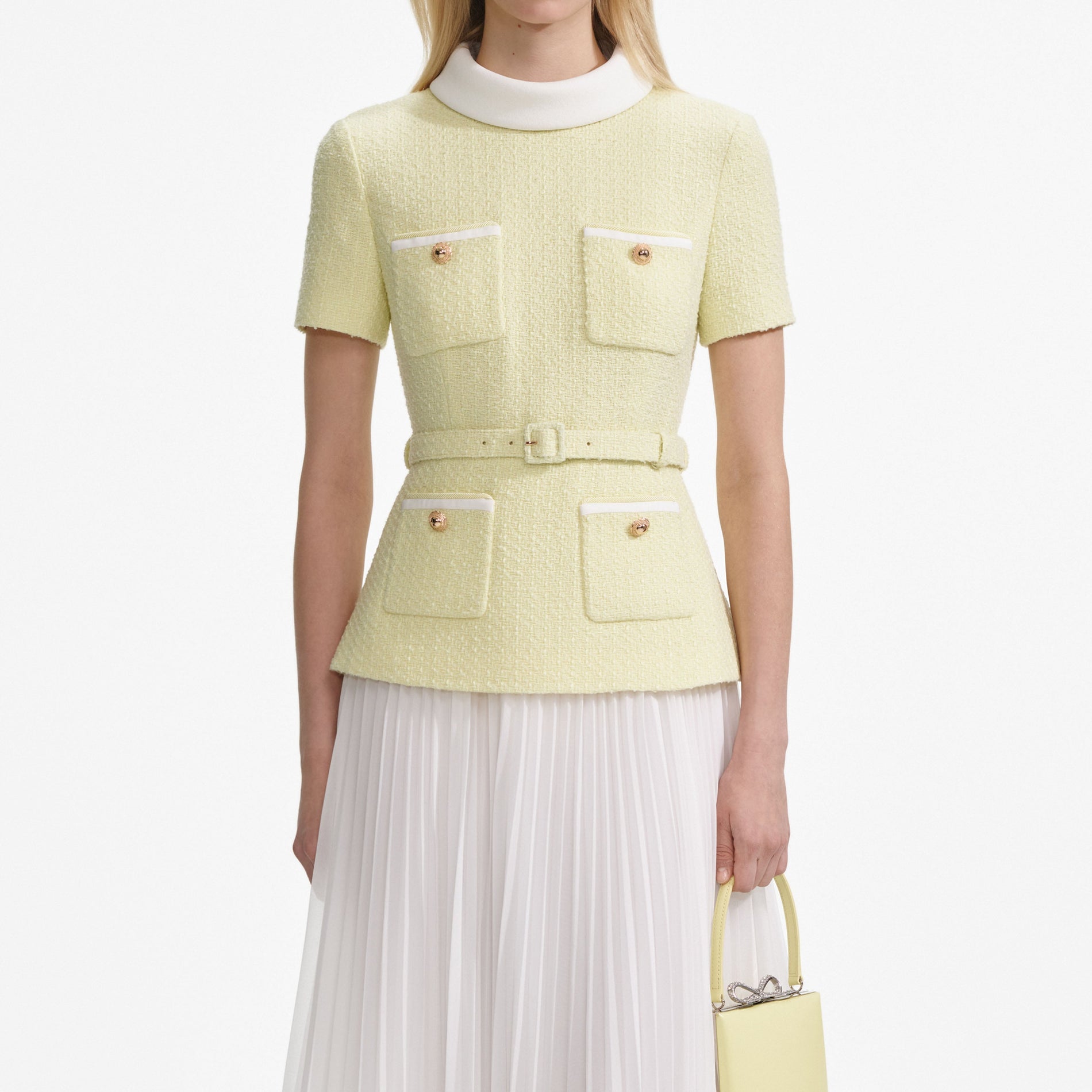 A close up of a woman wearing the Yellow Boucle Midi Dress