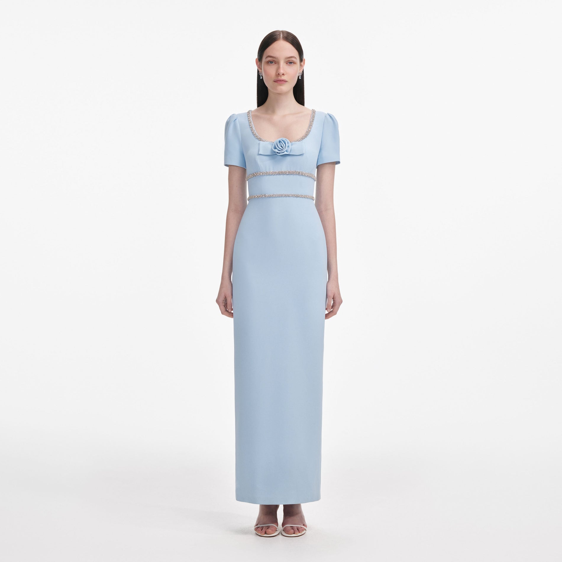 Front view of a woman wearing the Blue Crepe Crystal Trim Maxi Dress