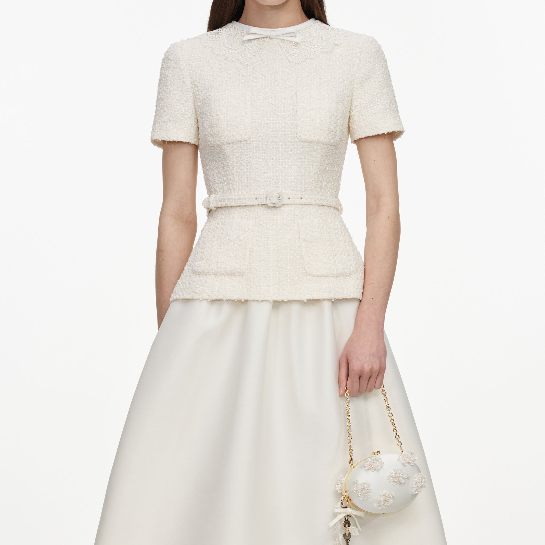 A close up of a woman wearing the Cream Boucle Taffeta Midi Dress