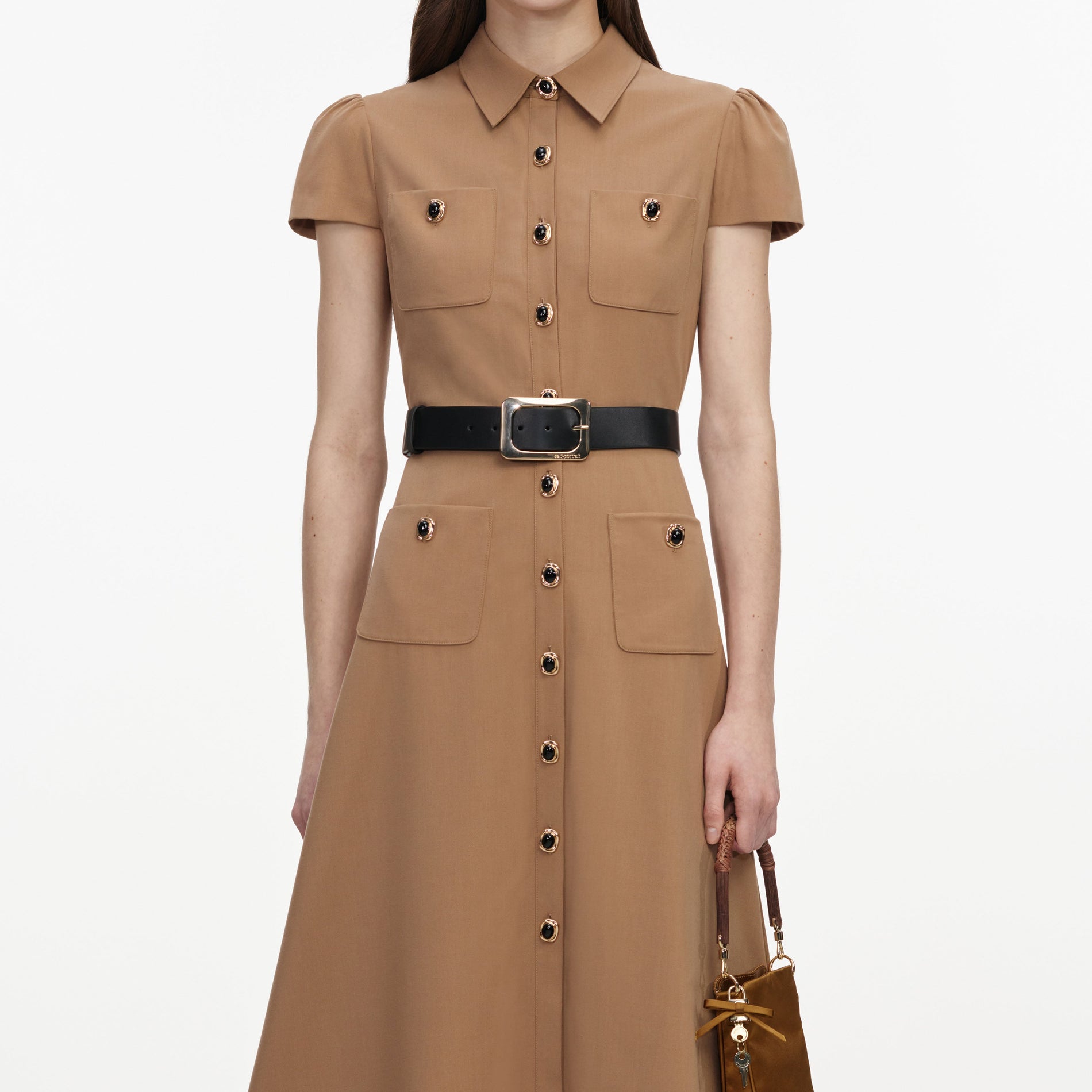 A close up of a woman wearing the Tan Twill Belted Midi Dress