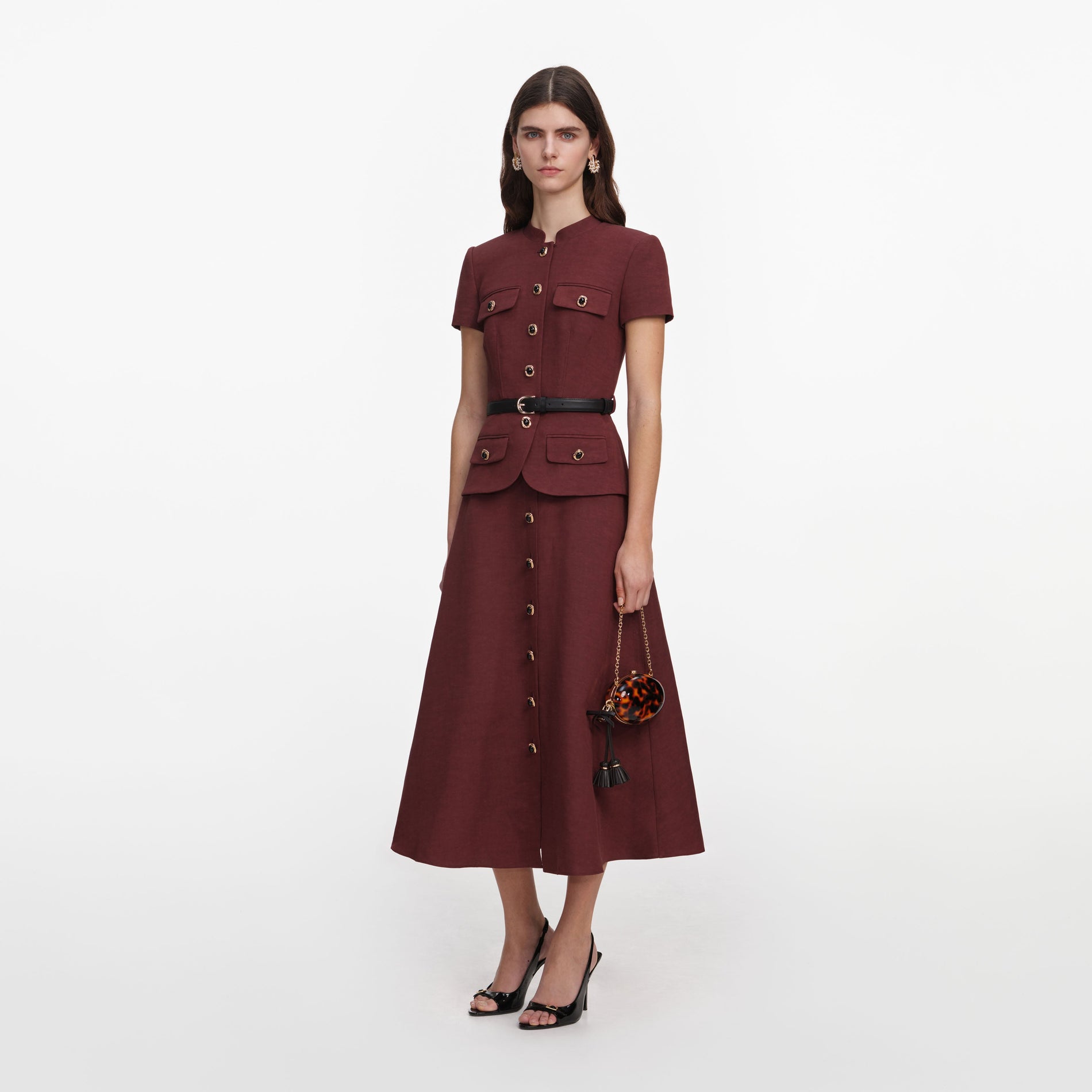 Side view of a woman wearing the Brown Peplum Linen Blend Midi Dress