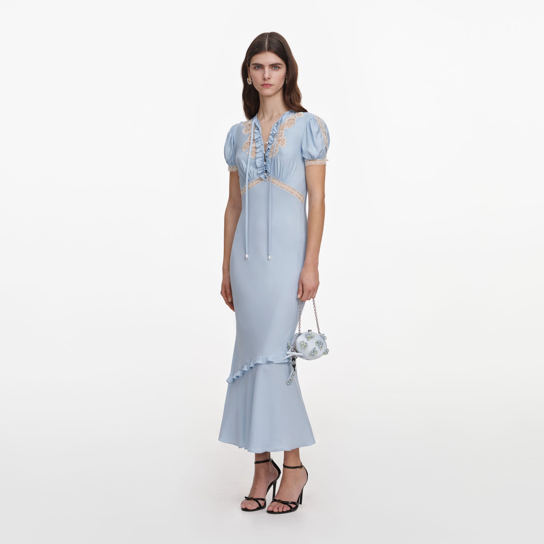 Side view of a woman wearing the Blue Viscose Lace Midi Dress