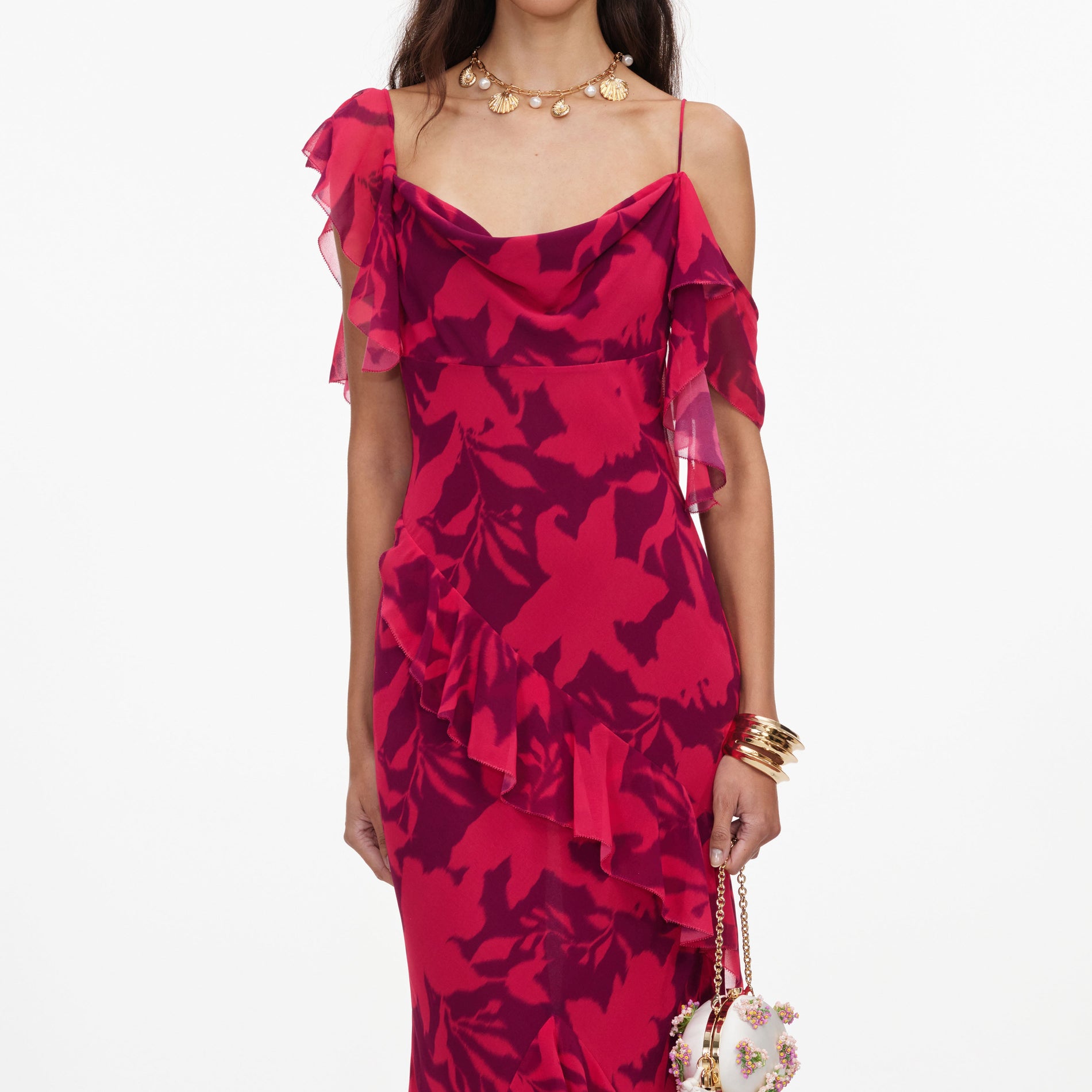 A close up of a woman wearing the Pink Floral Ruffle Maxi Dress