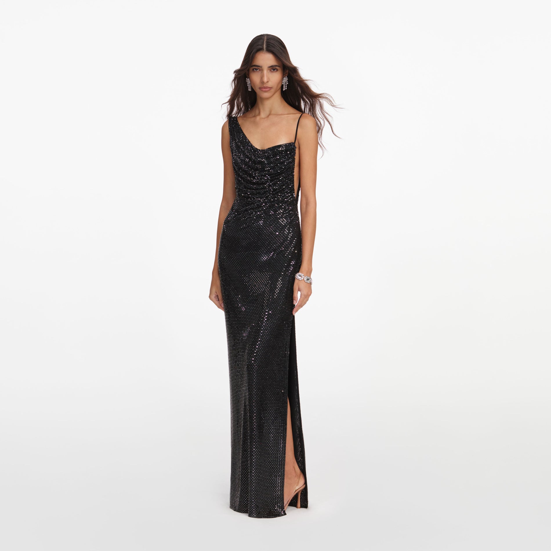 Side view of a woman wearing the Black Rhinestone Draped Maxi Dress