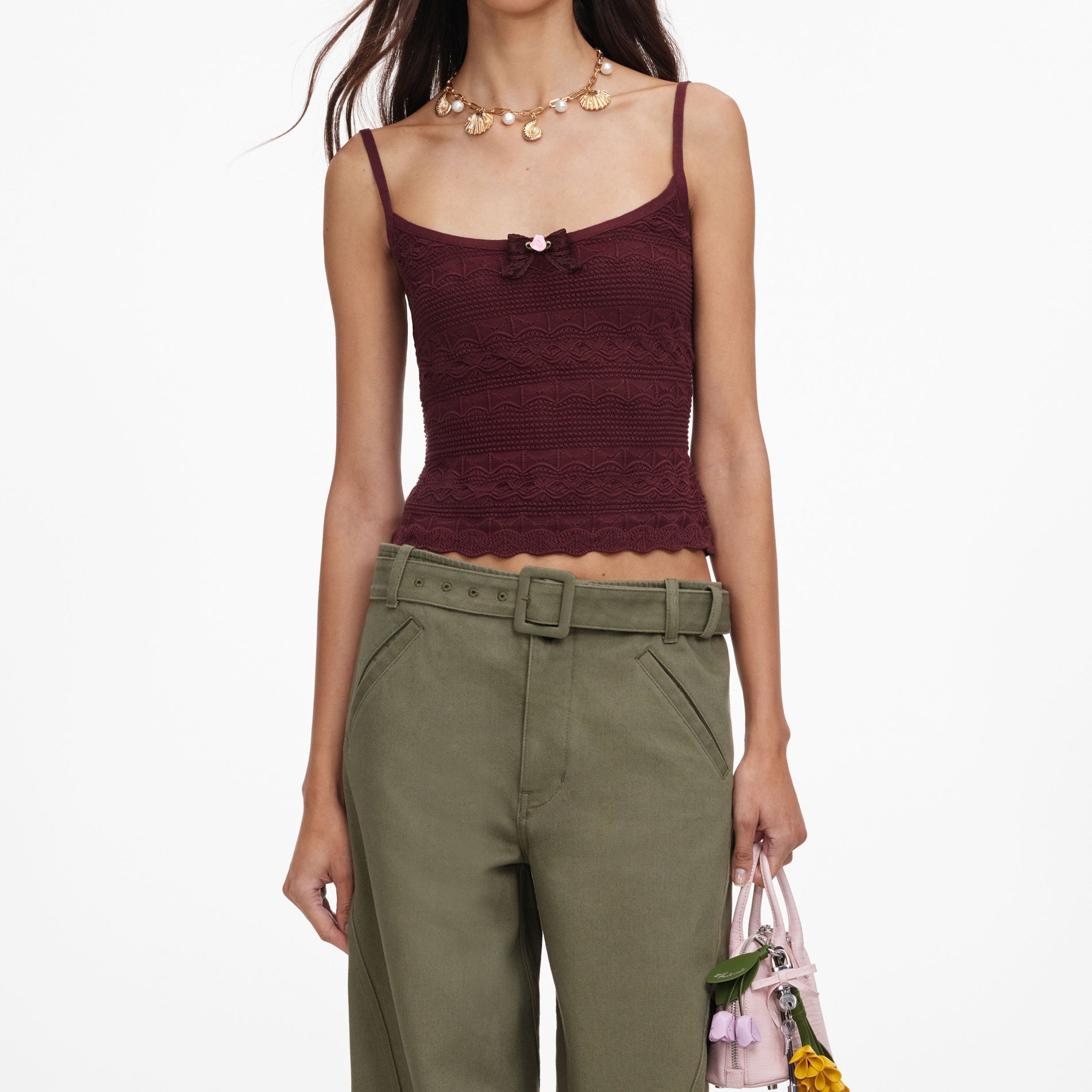 A close up of a woman wearing the Brown Pointelle Knit Vest