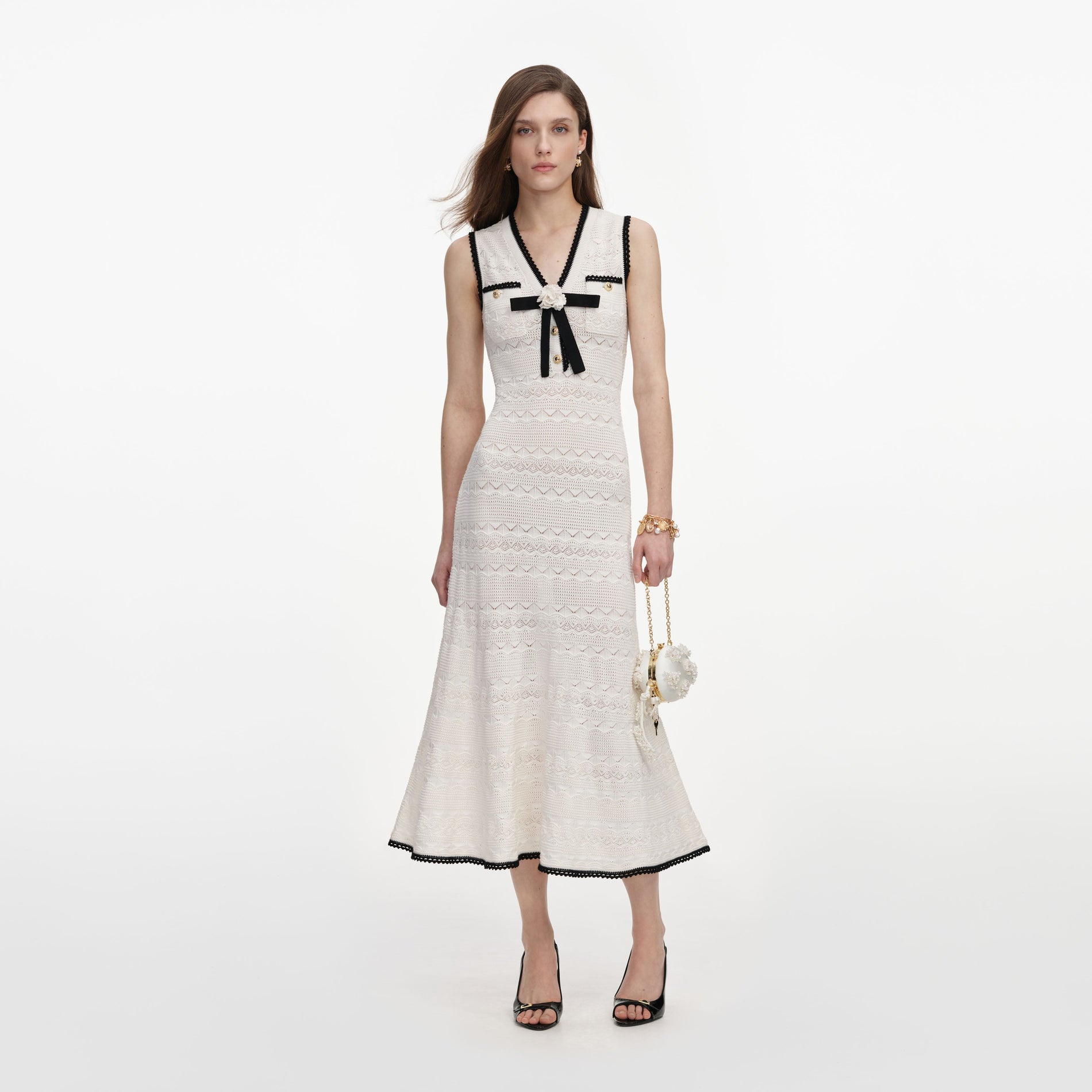 Front view of a woman wearing the White Pointelle Knit Midi Dress