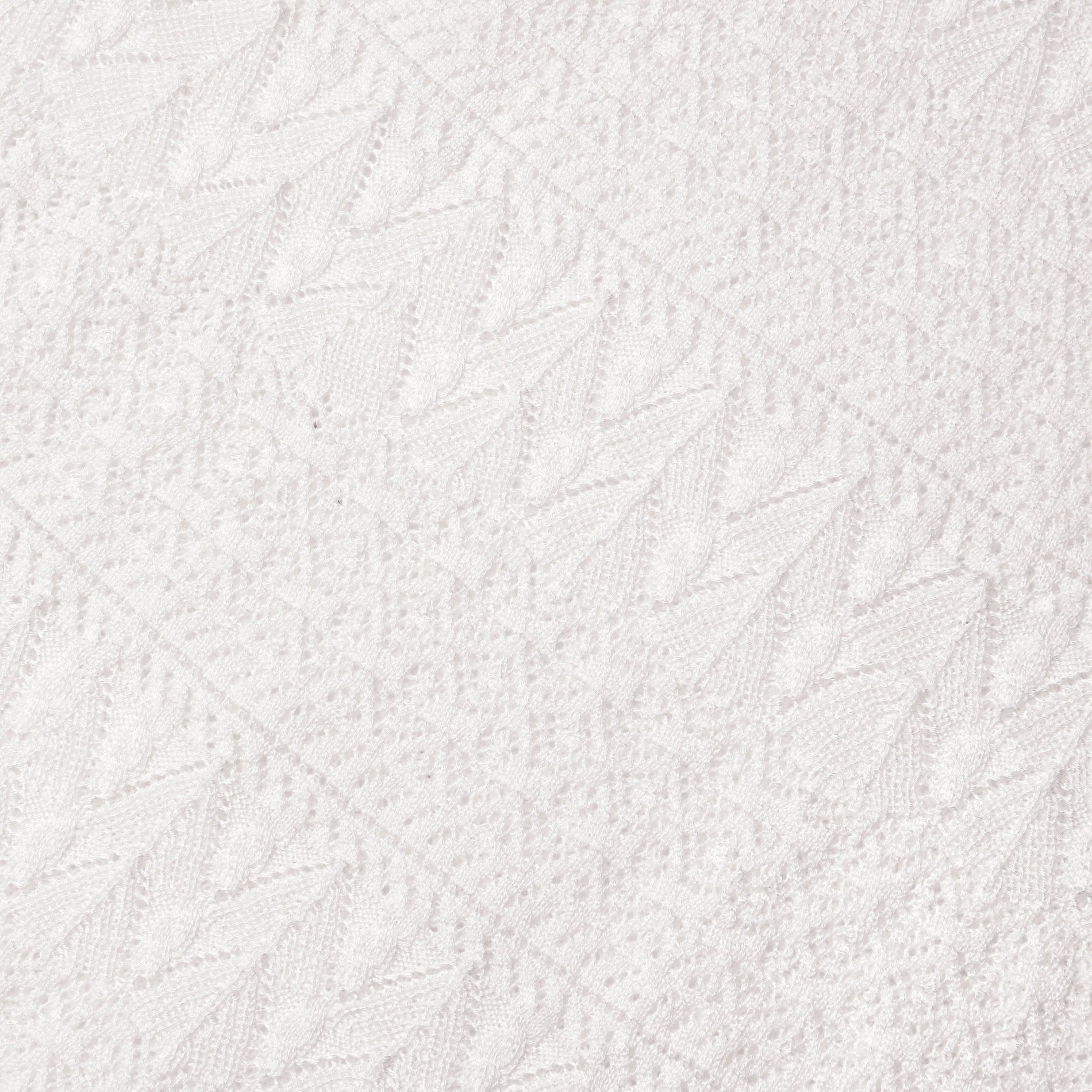 A close up of the fabric for the White Pointelle Knit Midi Skirt
