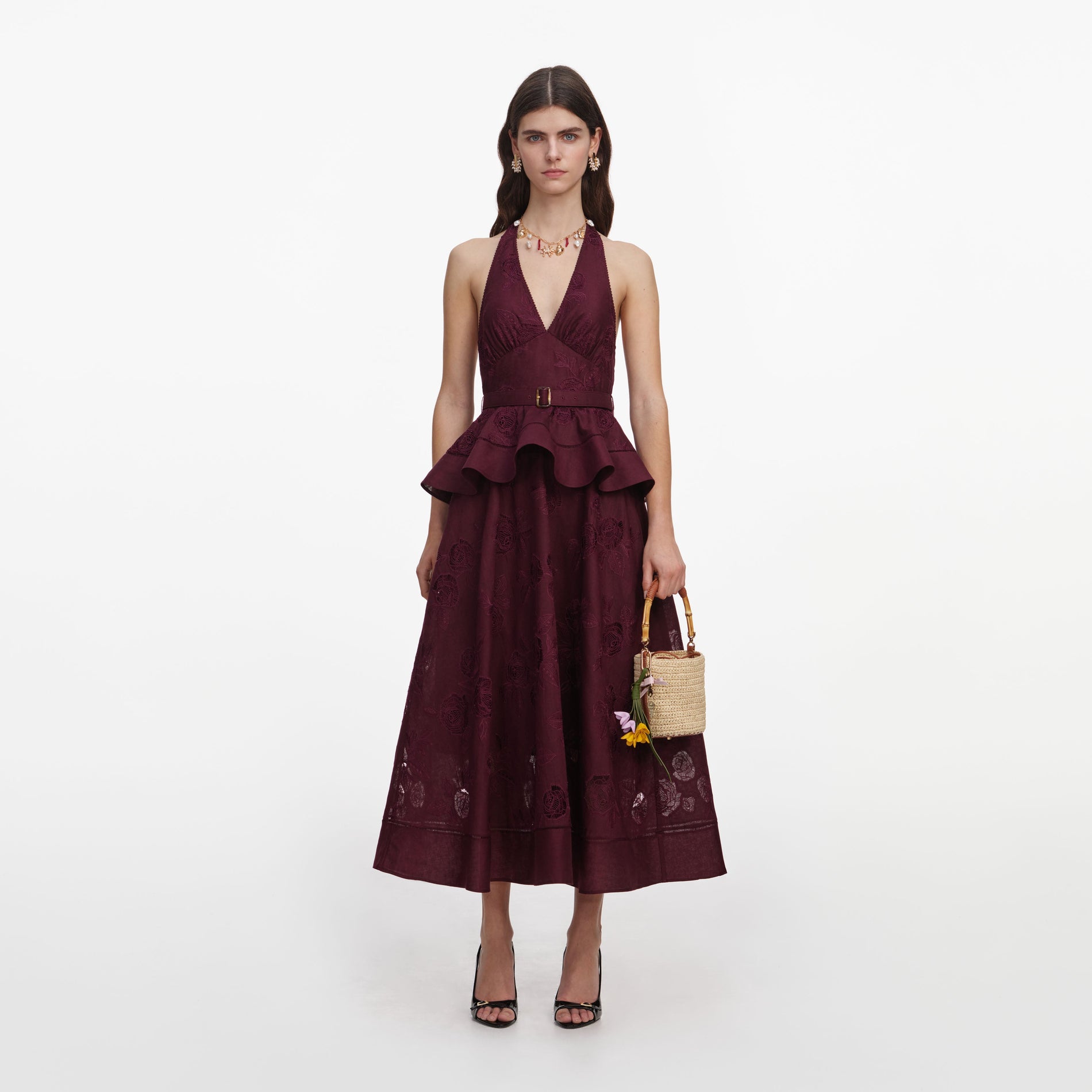 Front view of a woman wearing the Plum Linen Blend Peplum Midi Dress