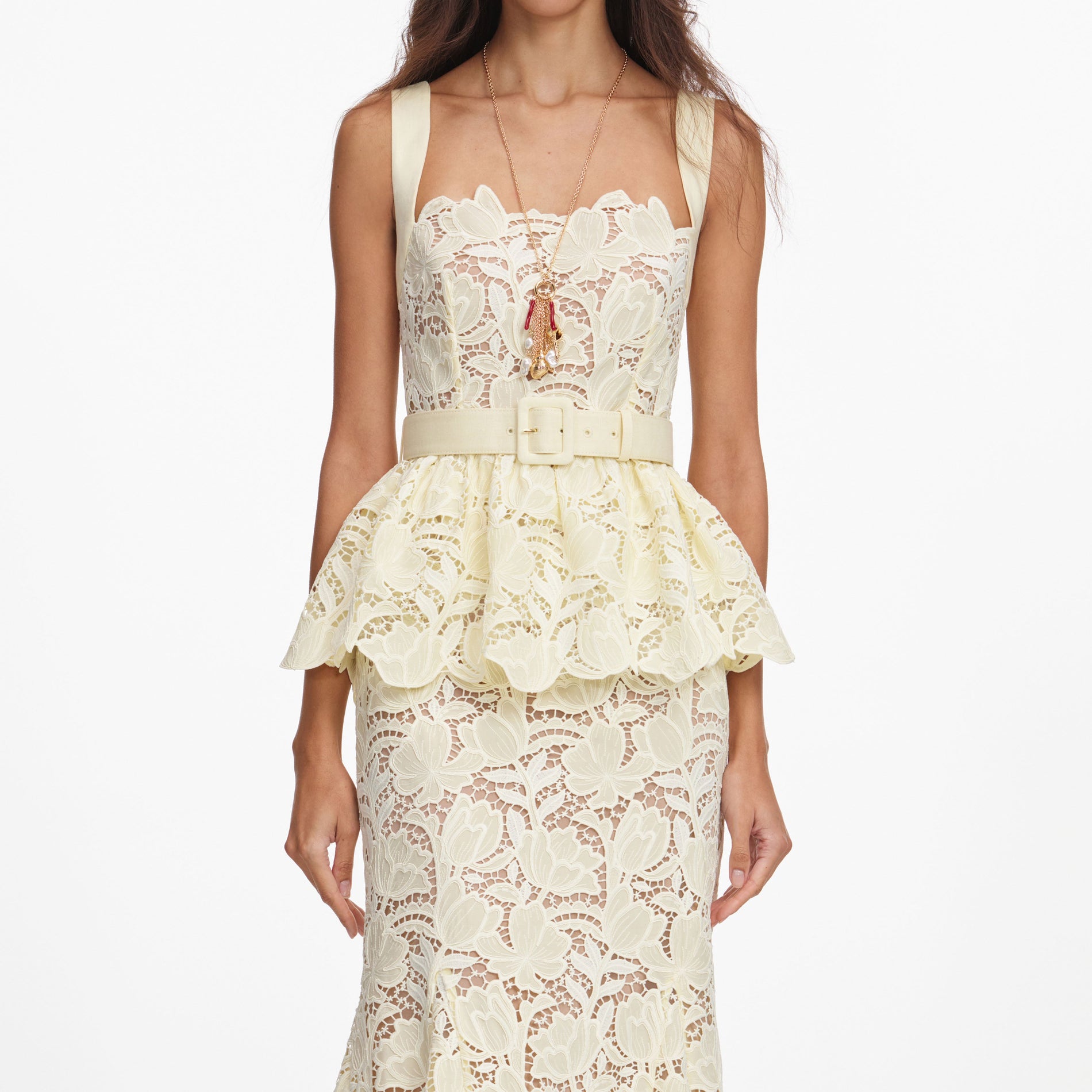 A close up of a woman wearing the Yellow Lace Peplum Midi Dress