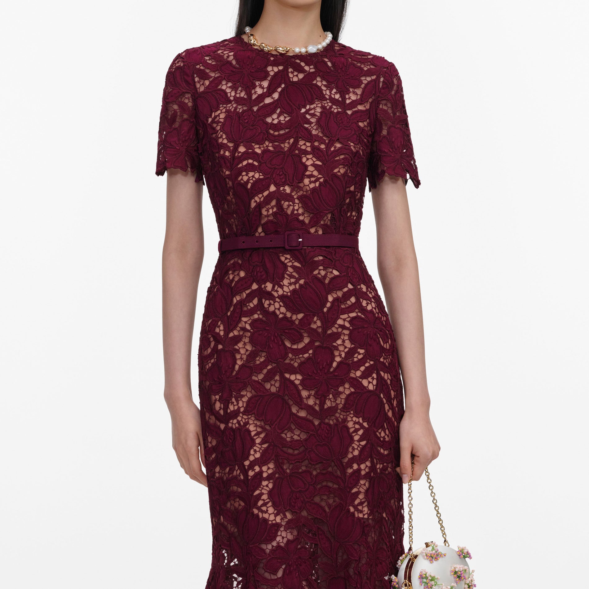A close up of a woman wearing the Burgundy Lace Midi Dress