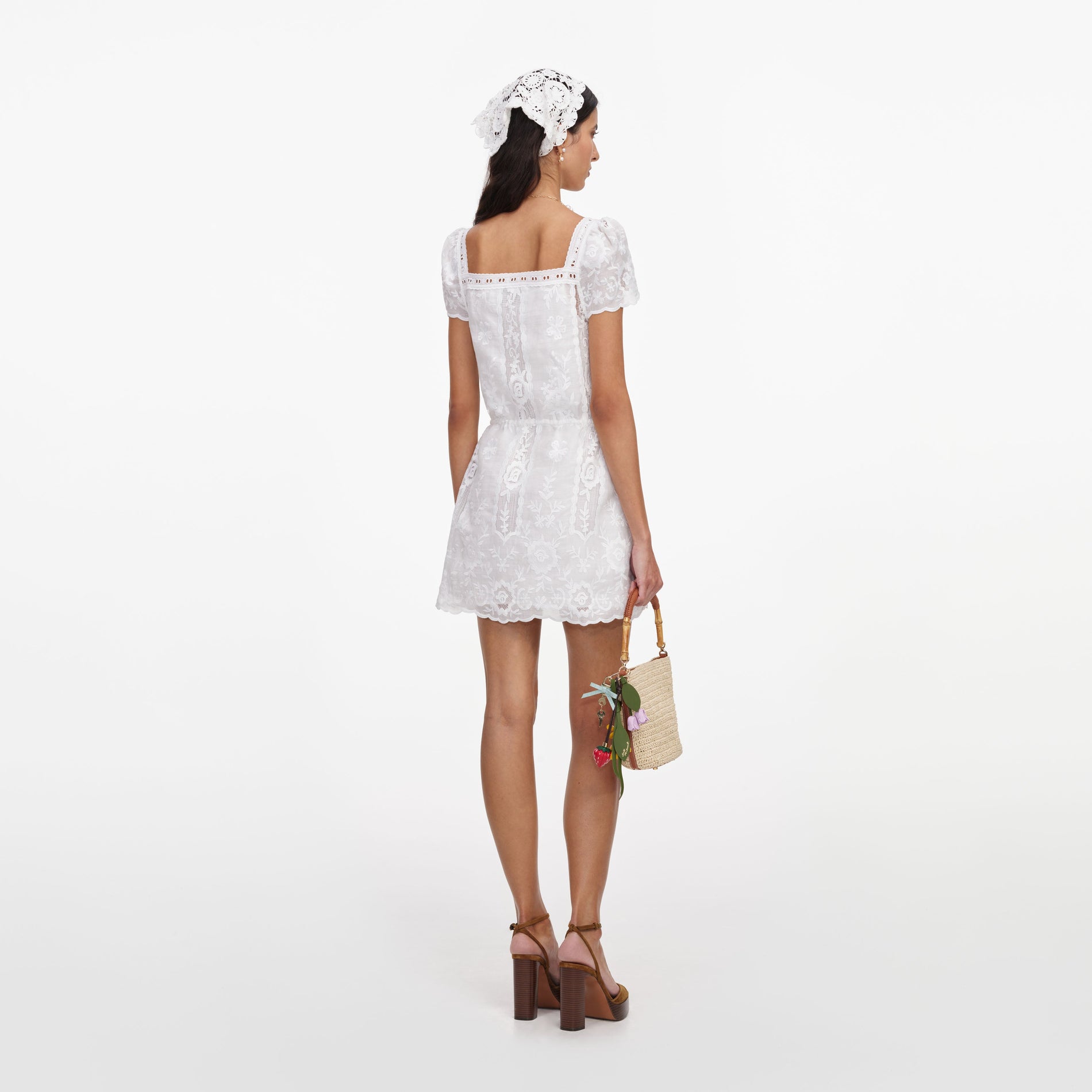 Back view of a woman wearing the White Ramie Mini Dress