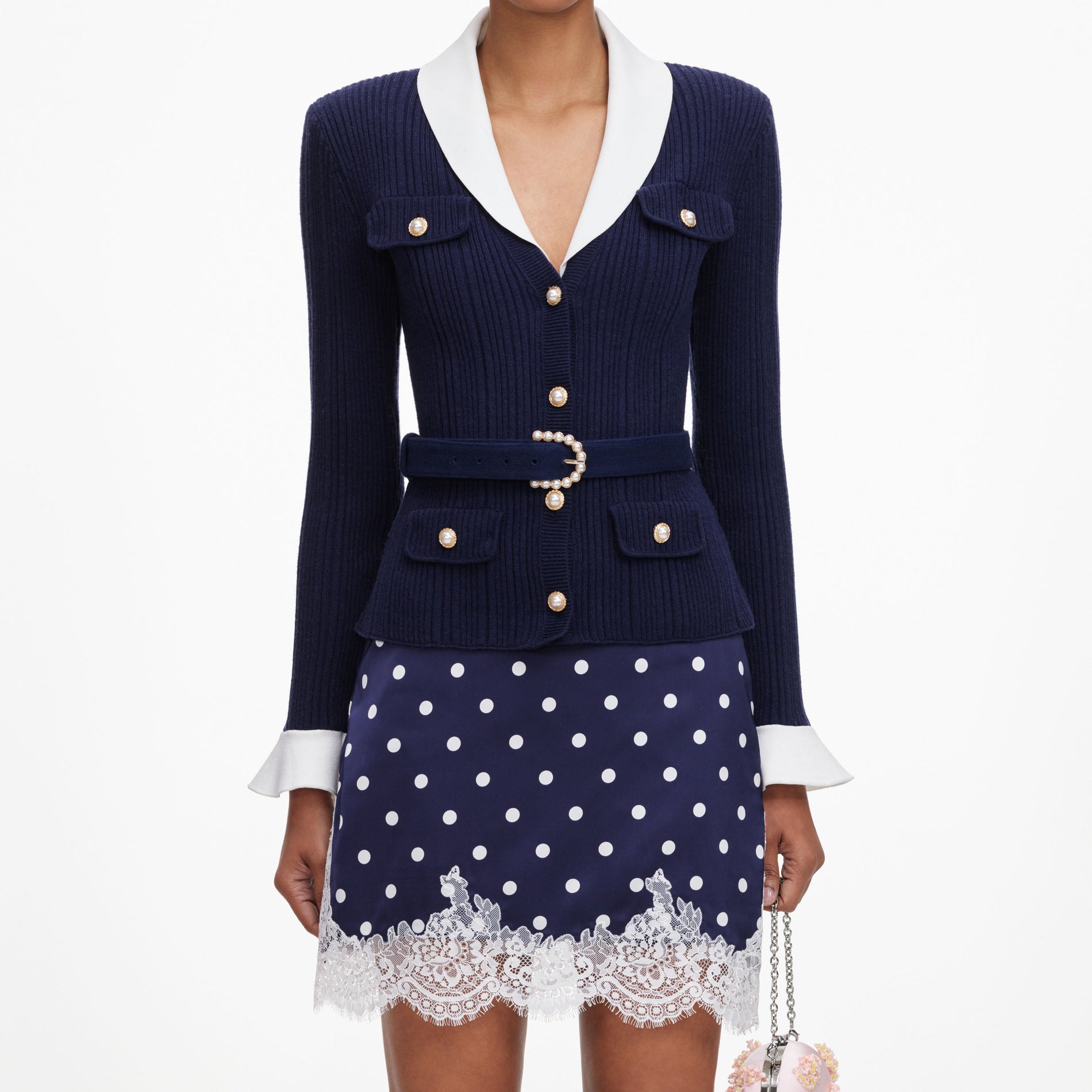 A close up of a woman wearing the Navy Ribbed Knit Cardigan