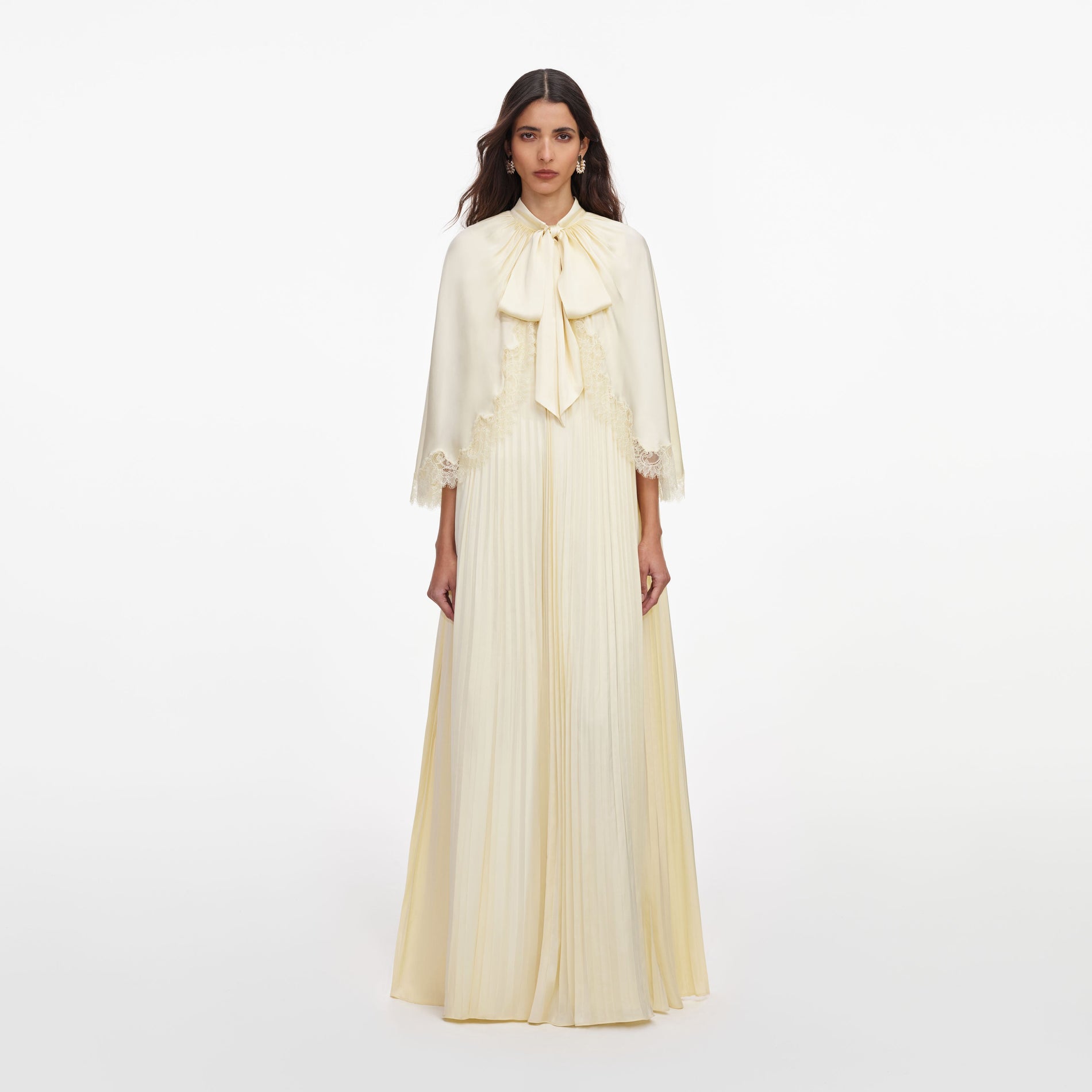 Front view of a woman wearing the Yellow Tie Neck Cape Maxi Dress