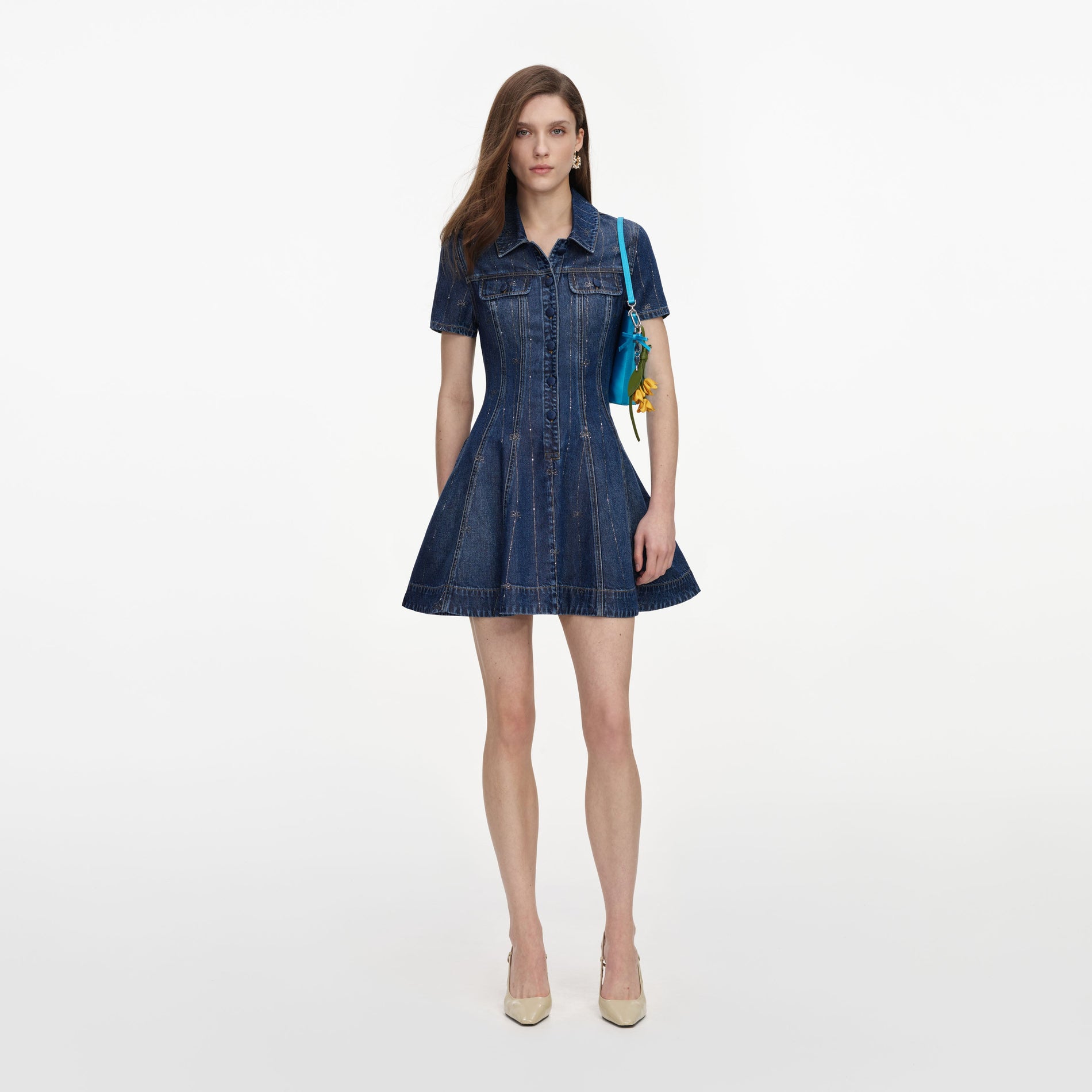 Front view of a woman wearing the Rhinestone Stripe Denim Mini Dress