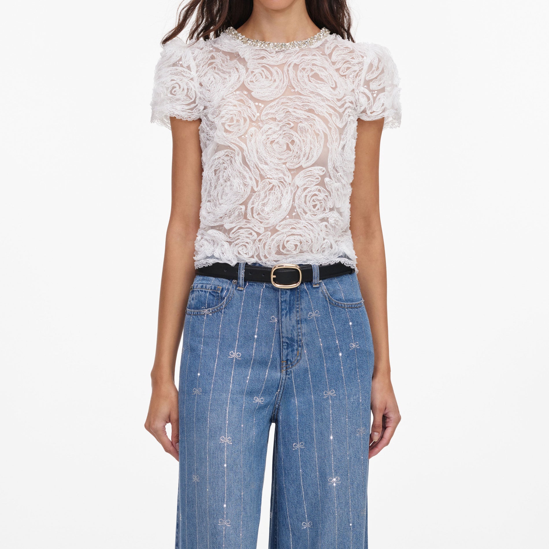 A close up of a woman wearing the Light Blue Rhinestone Stripe Denim Jeans