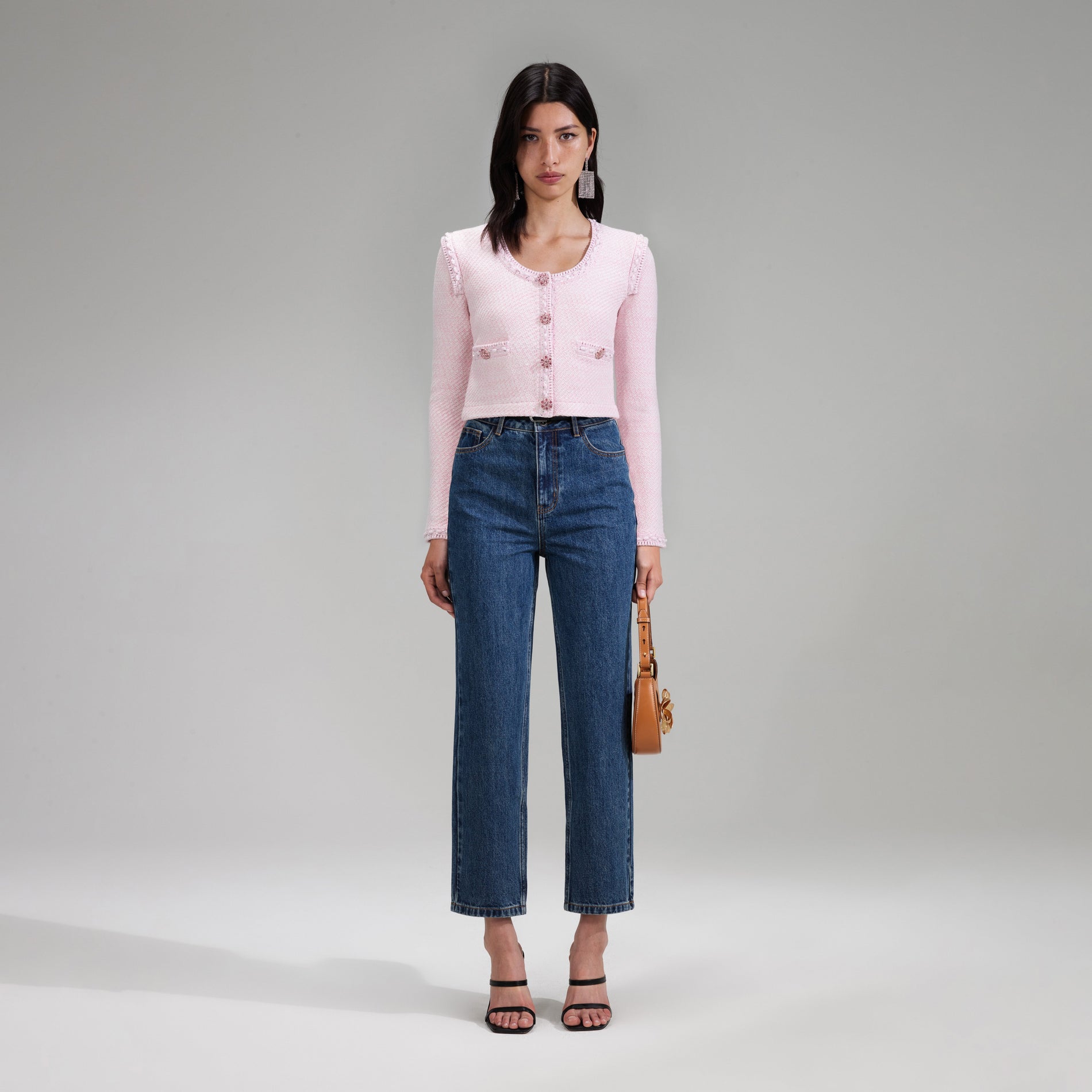 A woman wearing the Pink Knit Crop Cardigan