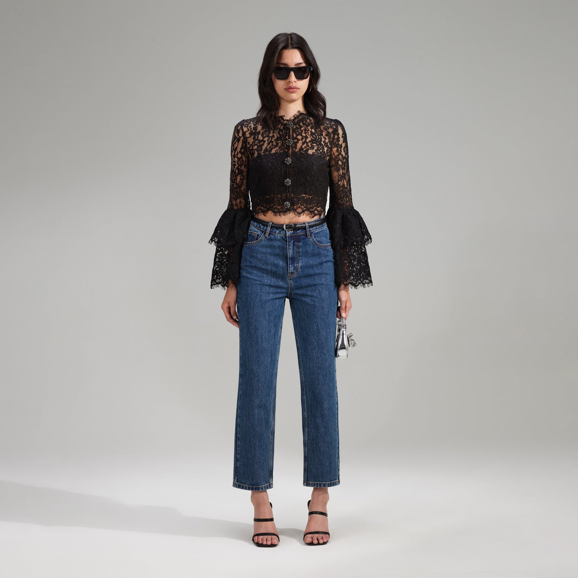 A woman wearing the Black Cord Lace Top