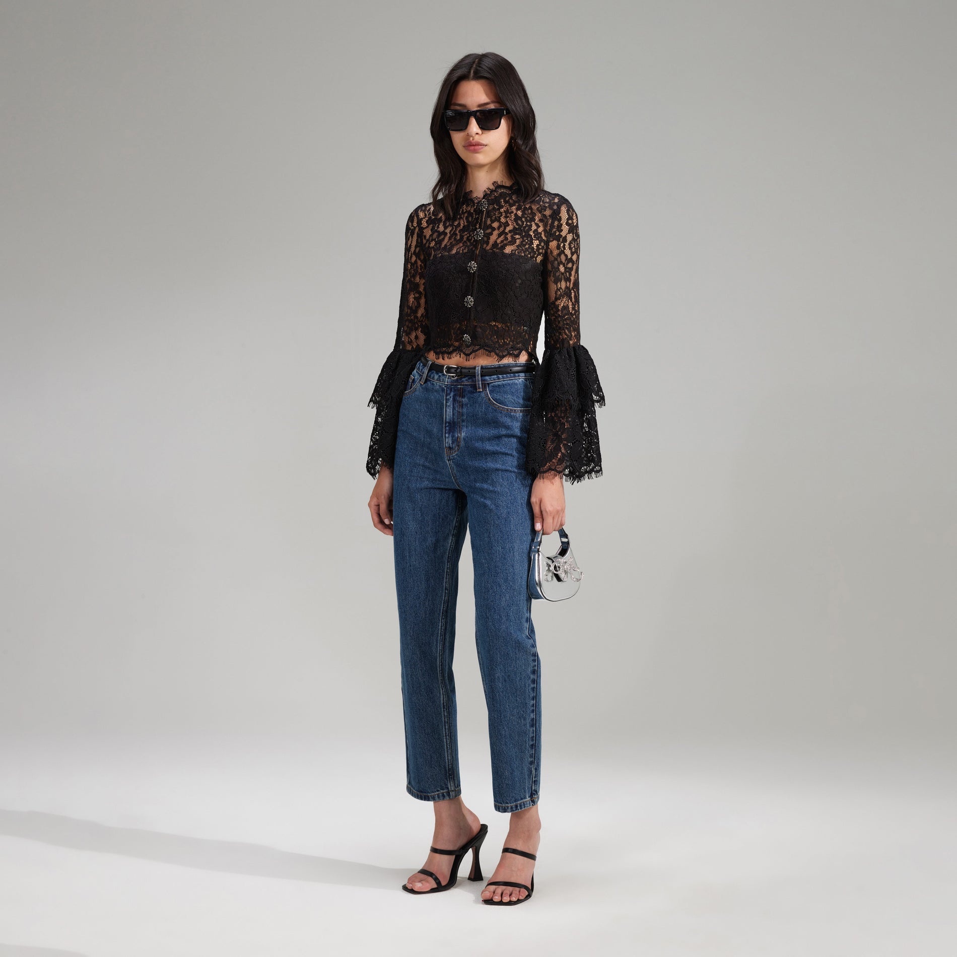 A woman wearing the Black Cord Lace Top