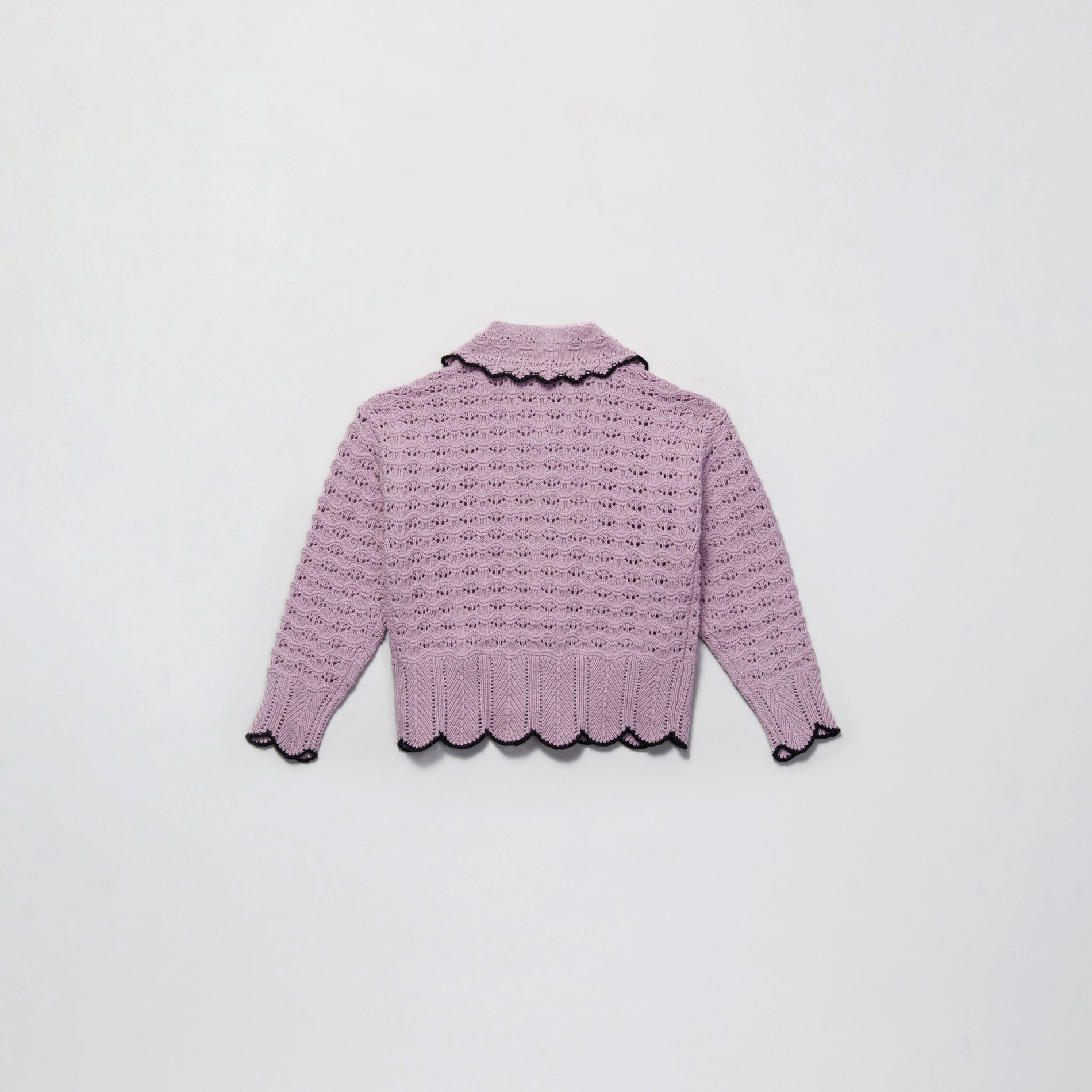 Side view of a woman wearing the Lilac Crochet Knit Cardigan