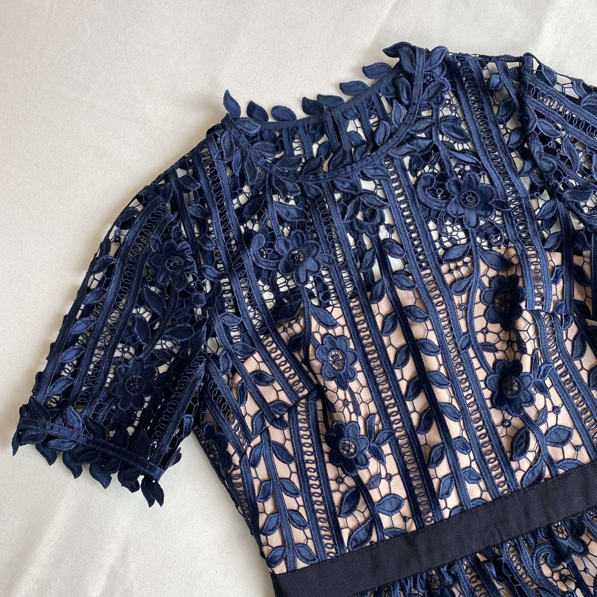 A close up of the fabric for the Navy Lace Midi Dress
