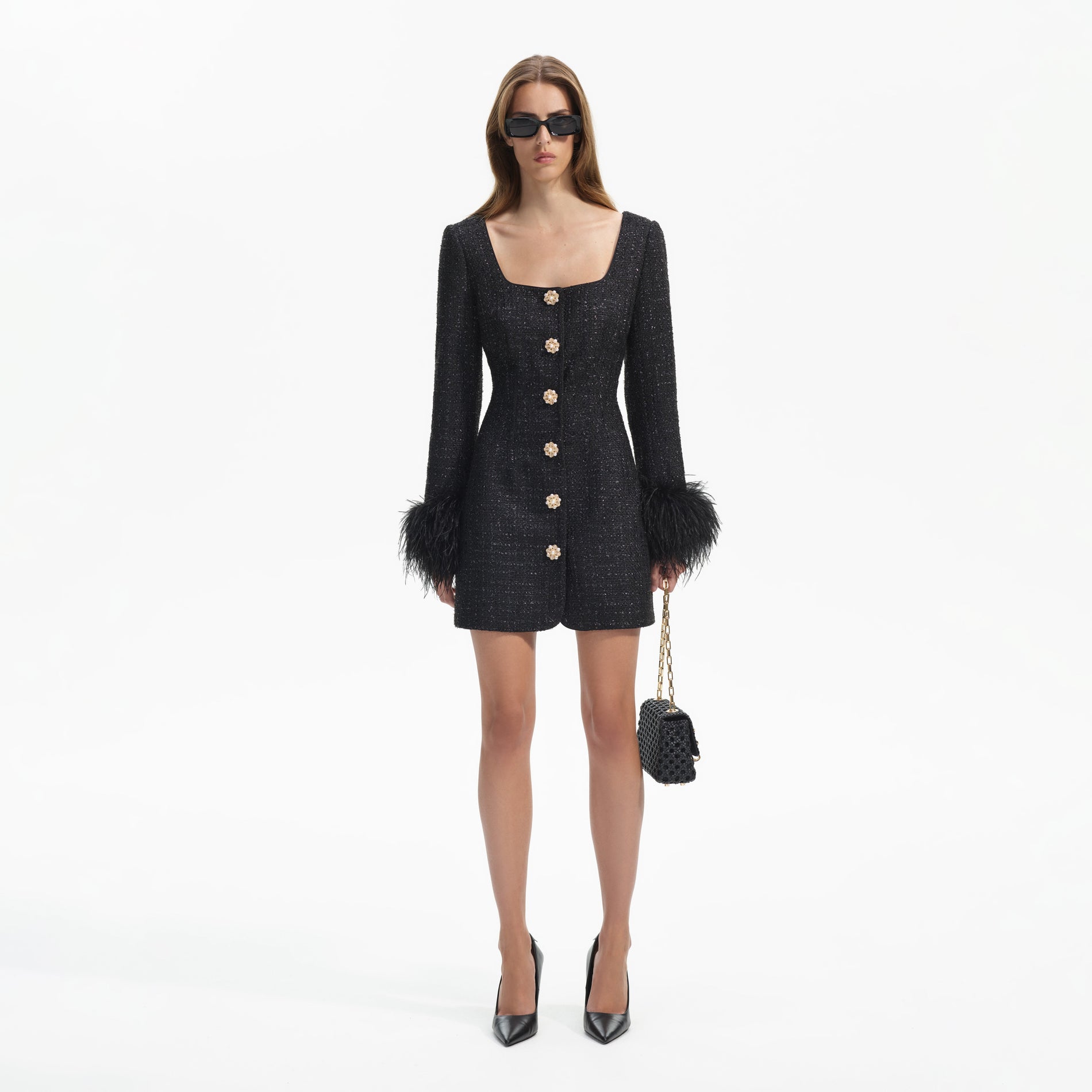 Front view of a woman wearing the Black Boucle Feather Mini Dress