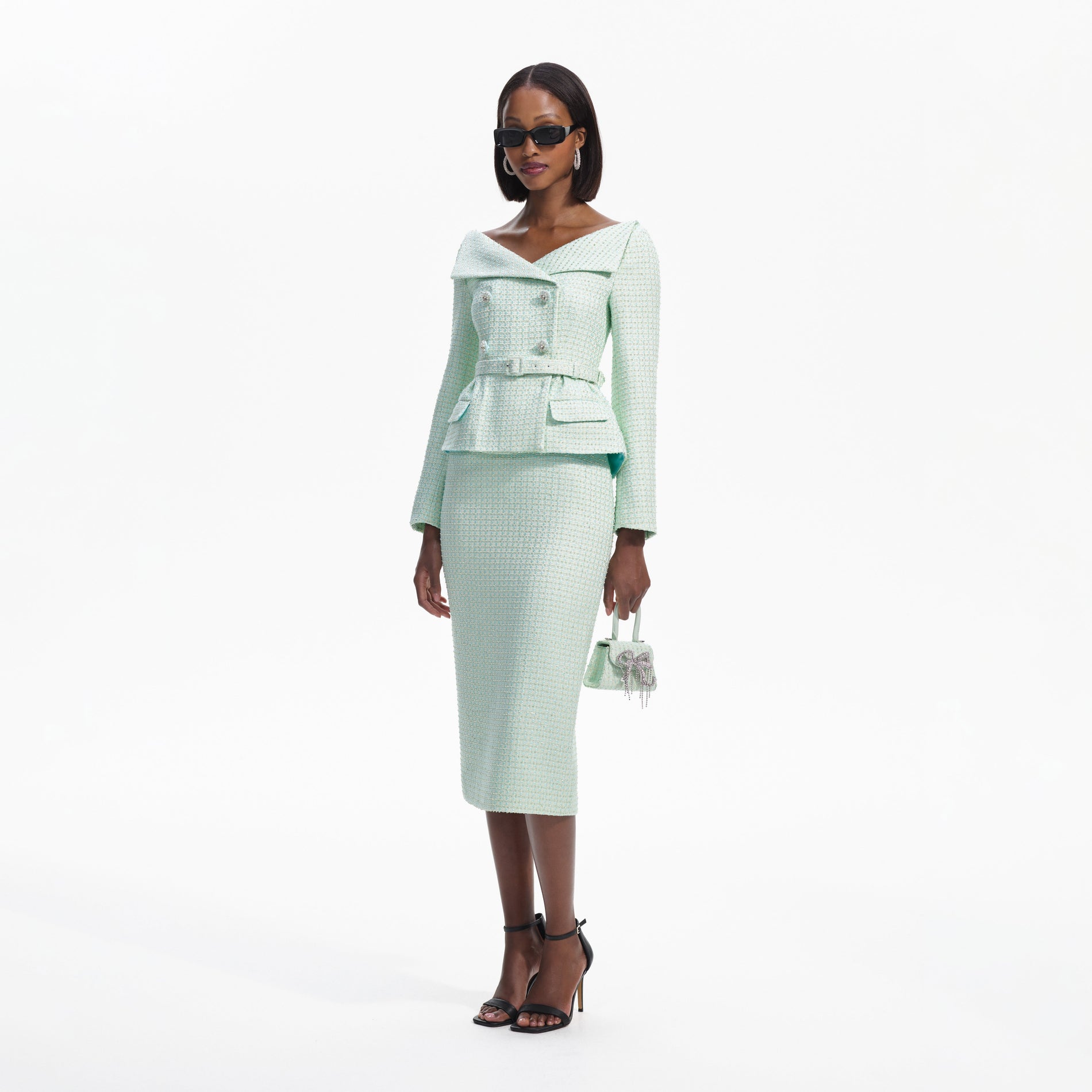 Side view of a woman wearing the Mint Boucle Tailored Midi Dress
