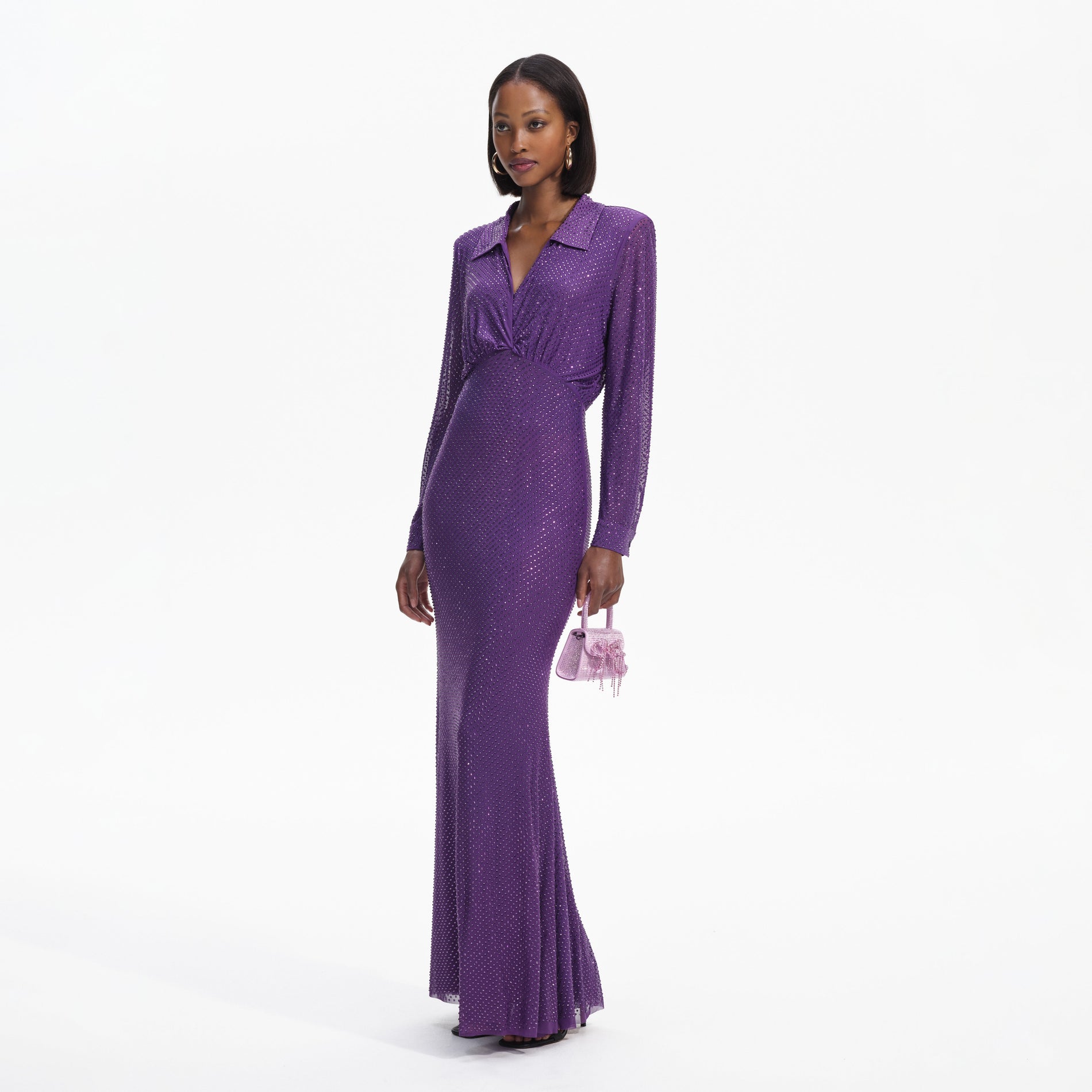 Side view of a woman wearing the Purple Rhinestone Mesh Maxi Dress
