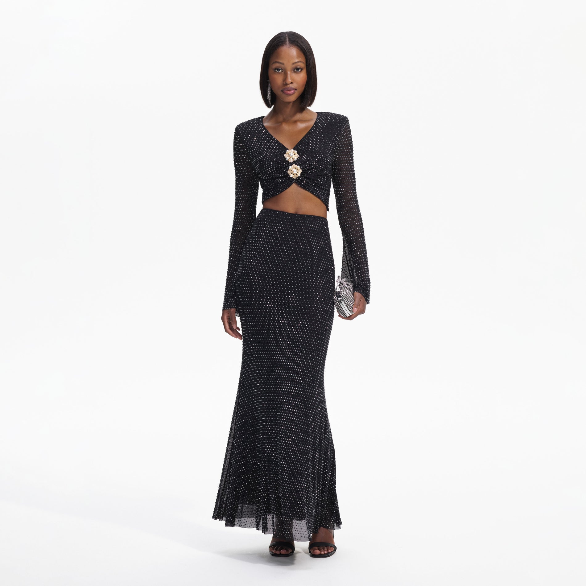 Front view of a woman wearing the Black Rhinestone Flared Sleeve Top
