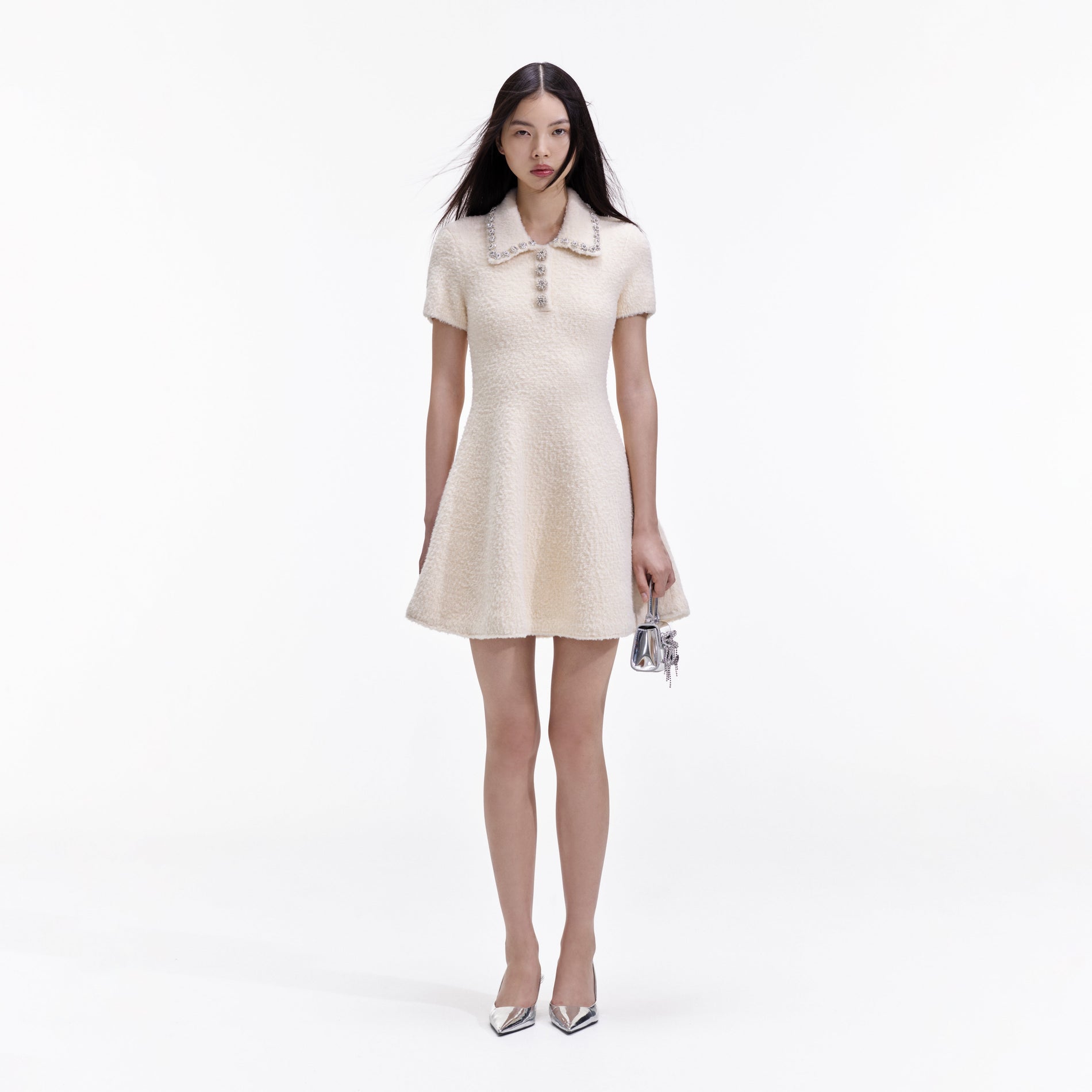 Front view of a woman wearing the Cream Soft Knit Mini Dress
