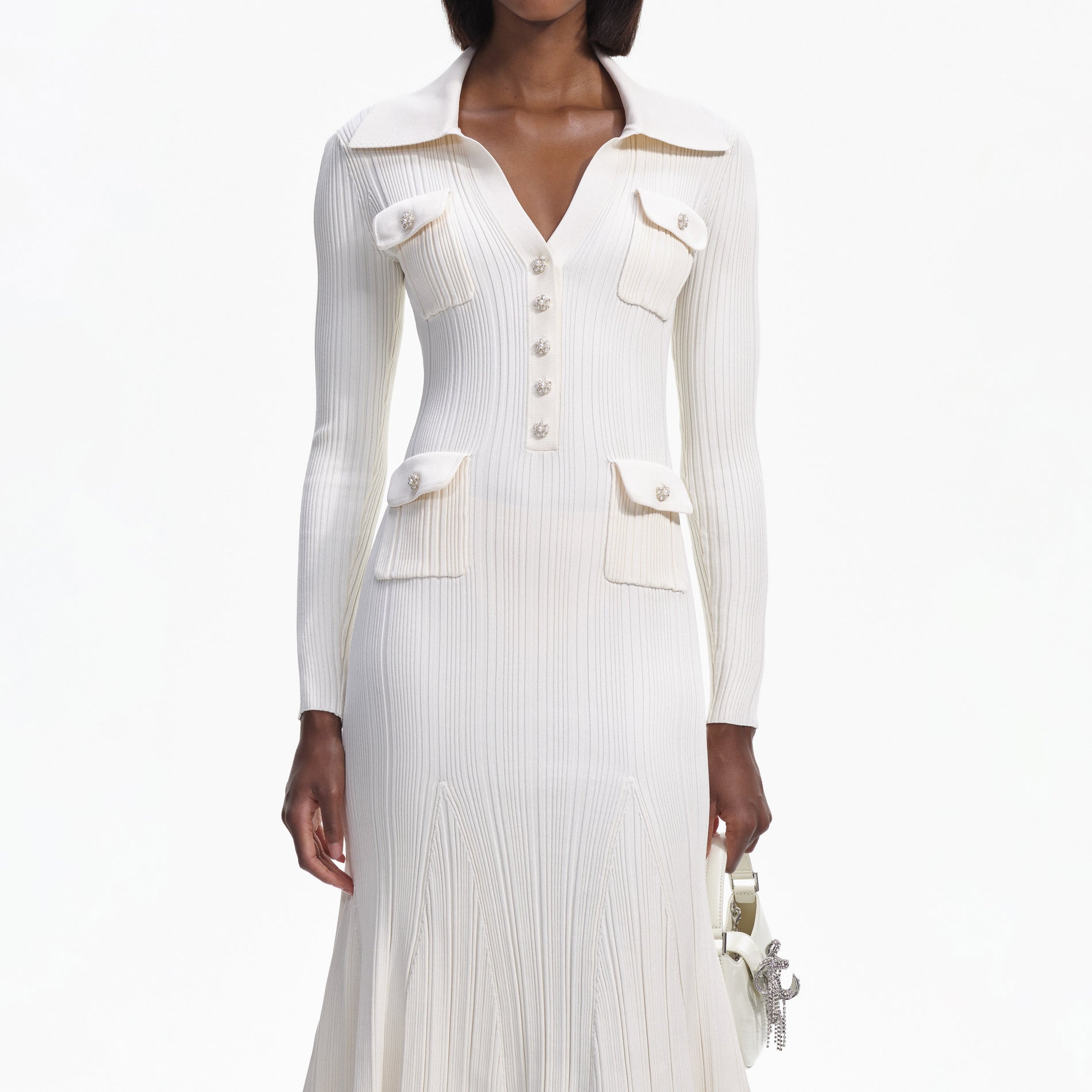 A close up of a woman wearing the Cream Knit Midi Dress