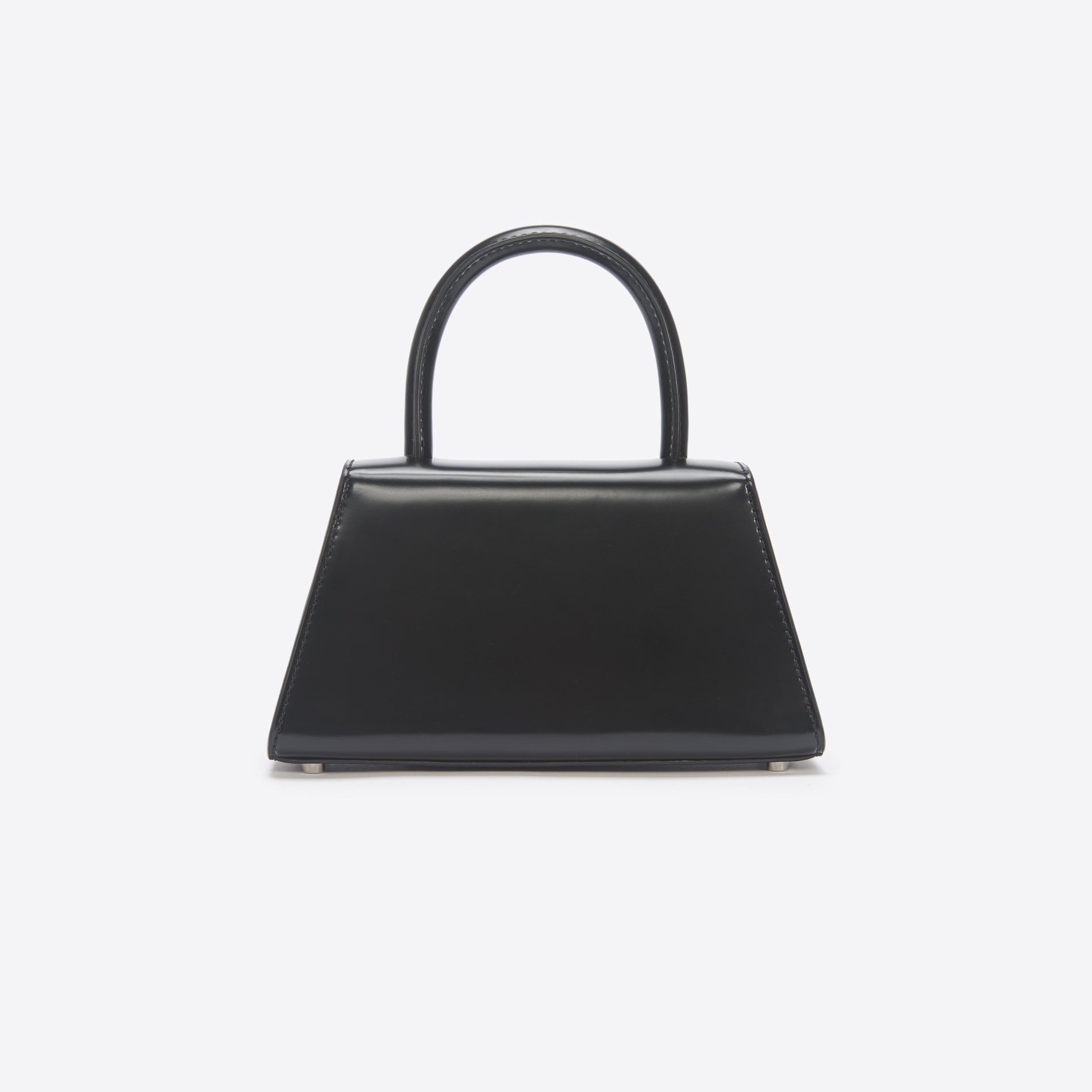 Side view of a woman wearing the Black Leather Mini Bow Bag