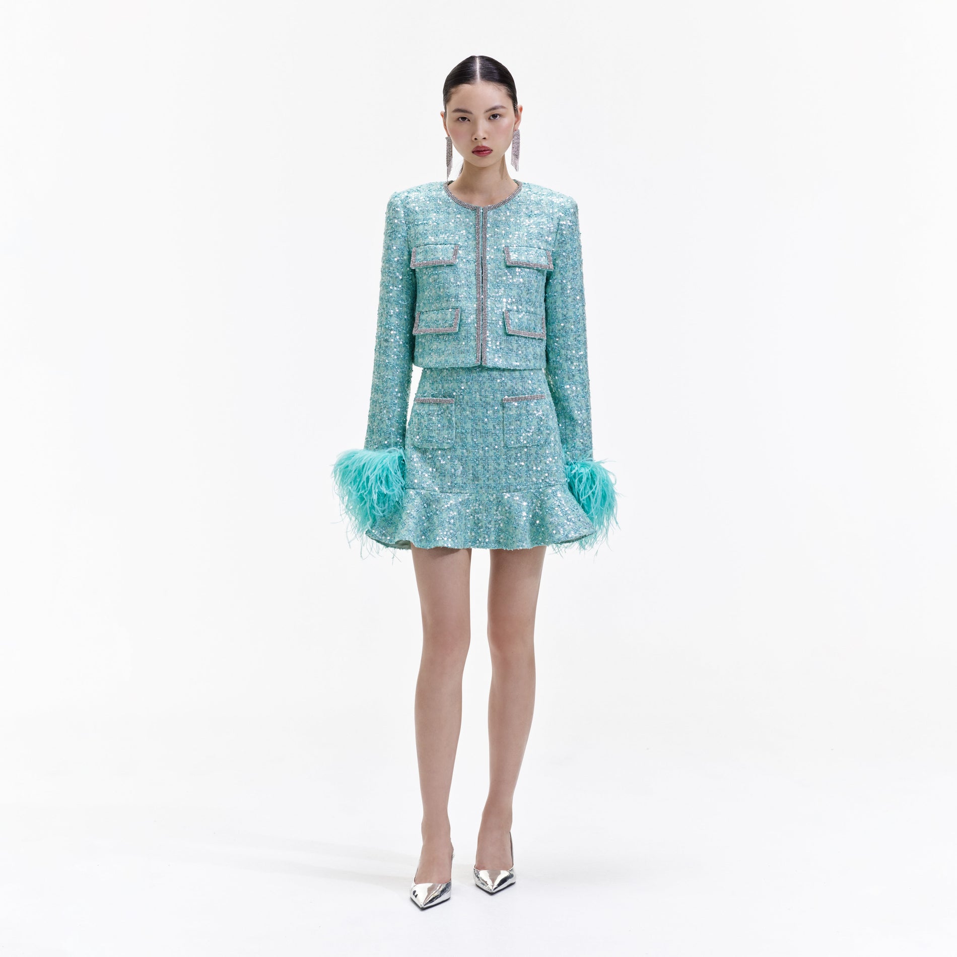Front view of a woman wearing the Blue Boucle Feather Jacket