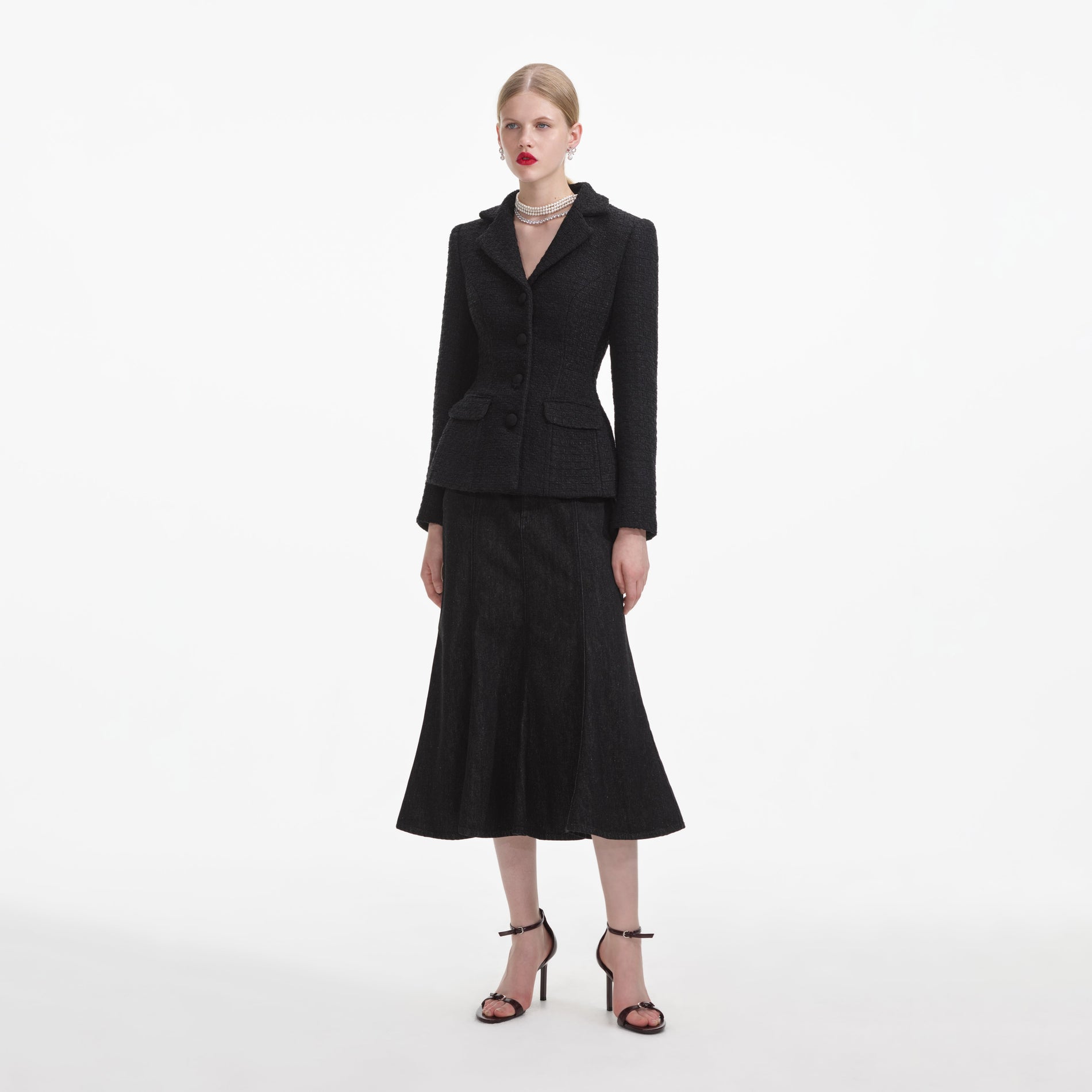 Side view of a woman wearing the Black Boucle Jacket