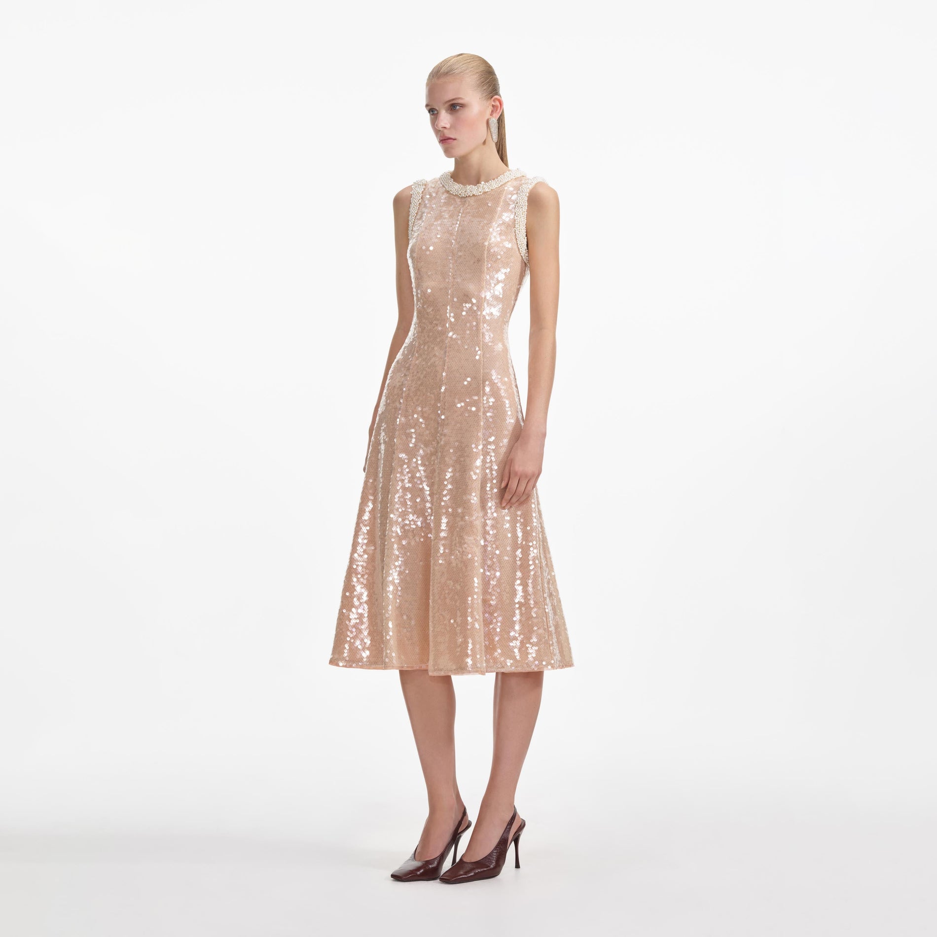 Side view of a woman wearing the Sequin Pearl Trim Midi Dress