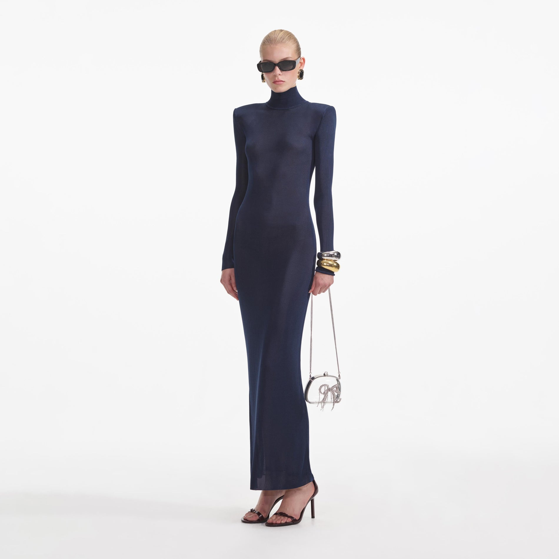 Side view of a woman wearing the Navy Viscose Knit Maxi Dress