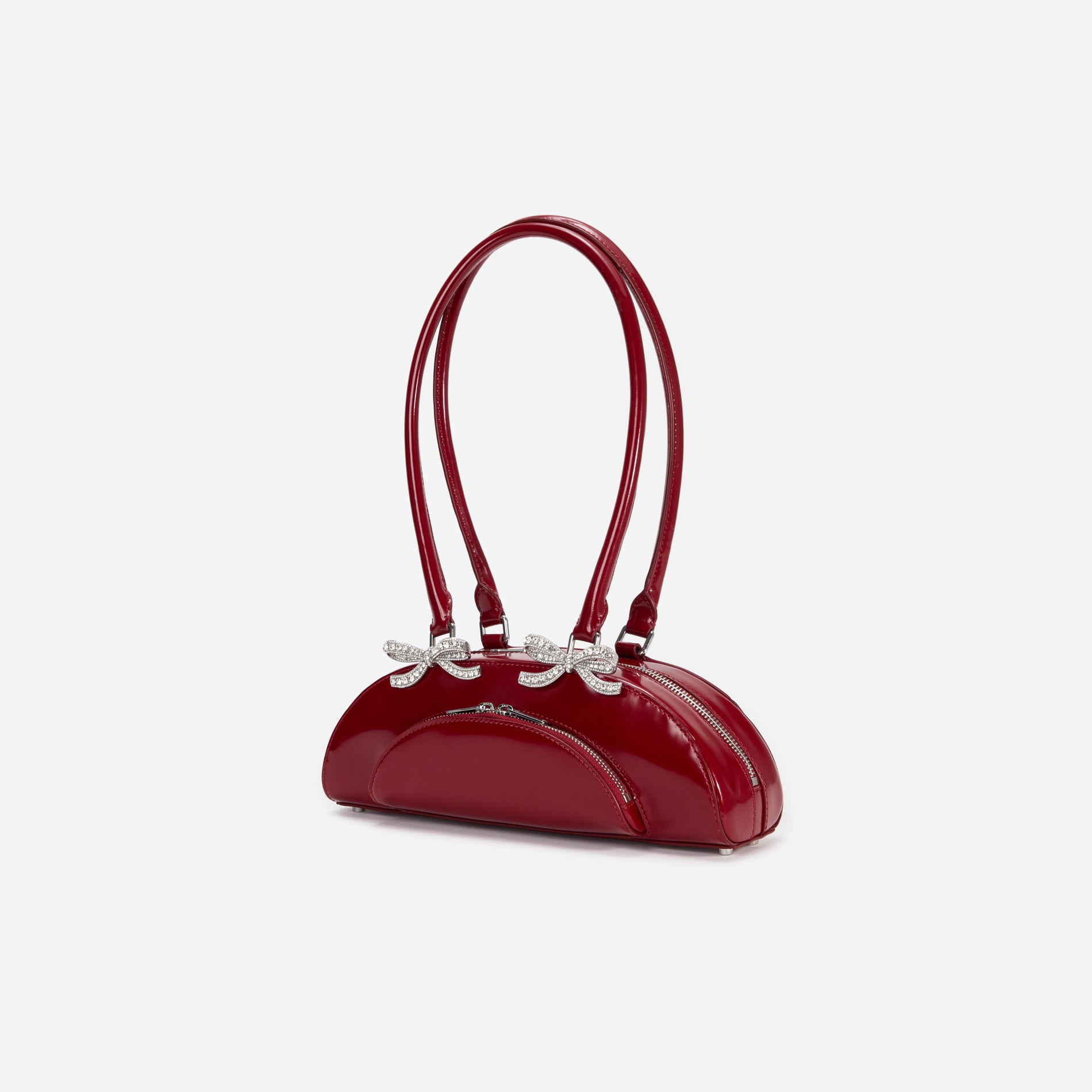 Side view of a woman wearing the Burgundy Leather Curved Shoulder Bag