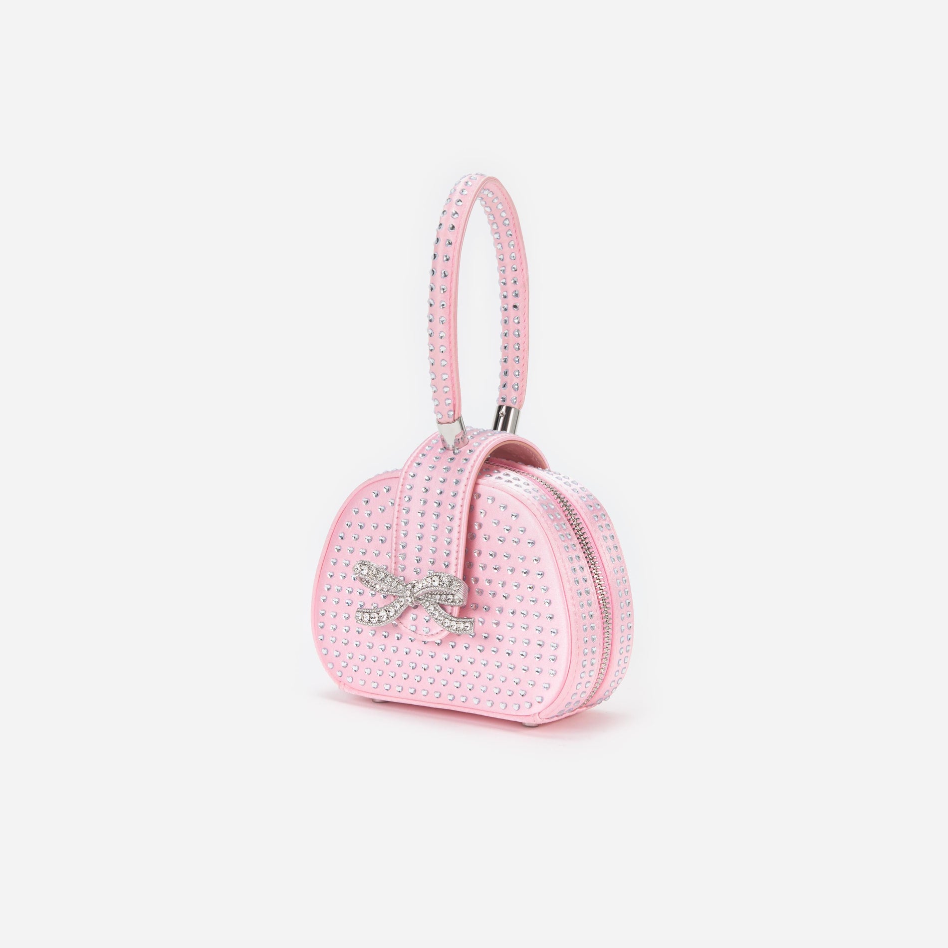 Side view of a woman wearing the Pink Heart Rhinestone Bag