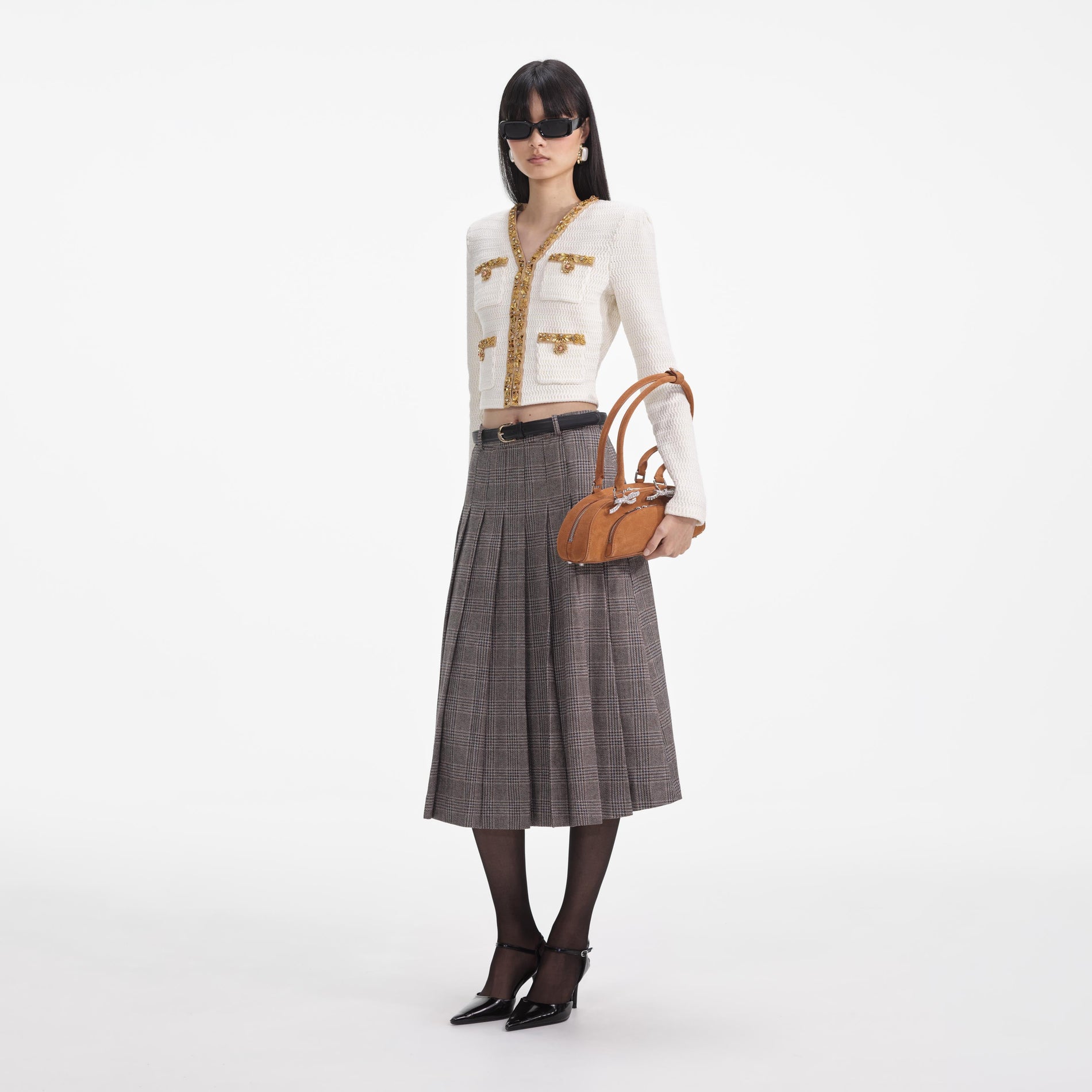 Side view of a woman wearing the Cream Lurex Knit Cardigan