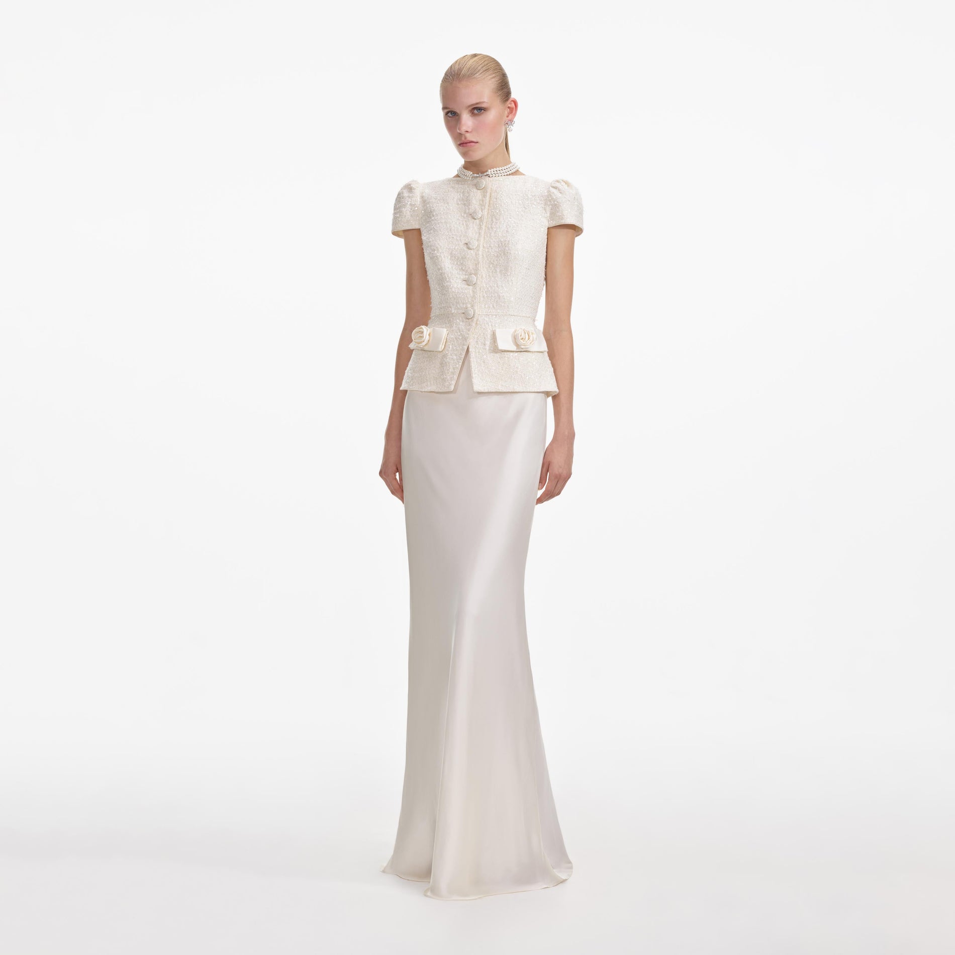 Side view of a woman wearing the Cream Boucle Bow Detail Maxi Dress