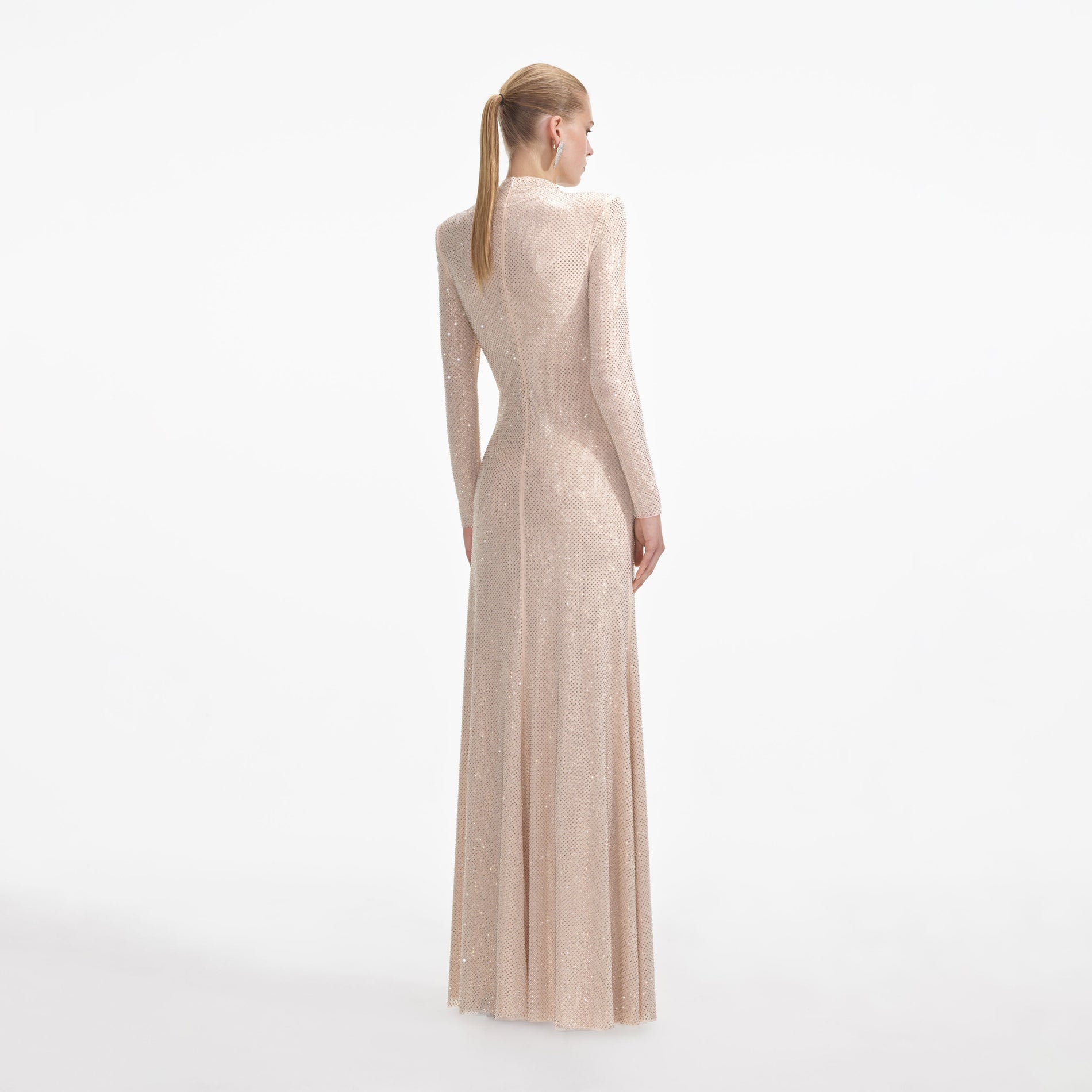 Back view of a woman wearing the Gold Rhinestone Mesh Cut Out Maxi Dress