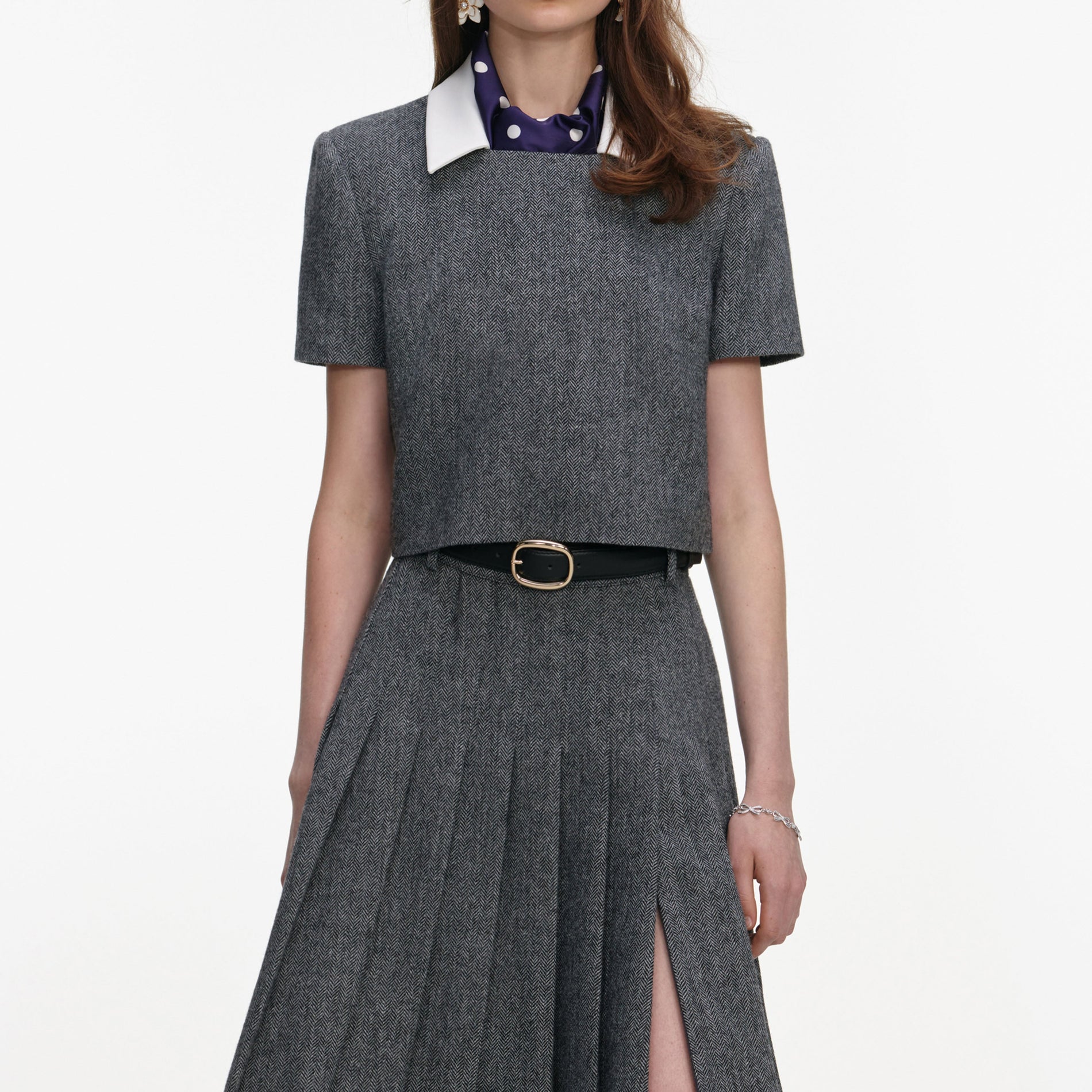 A close up of a woman wearing the Grey Herringbone Scarf Detail Top